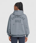 gymshark-gslc-graphic-oversized-hoodie-iron-blue-ss25