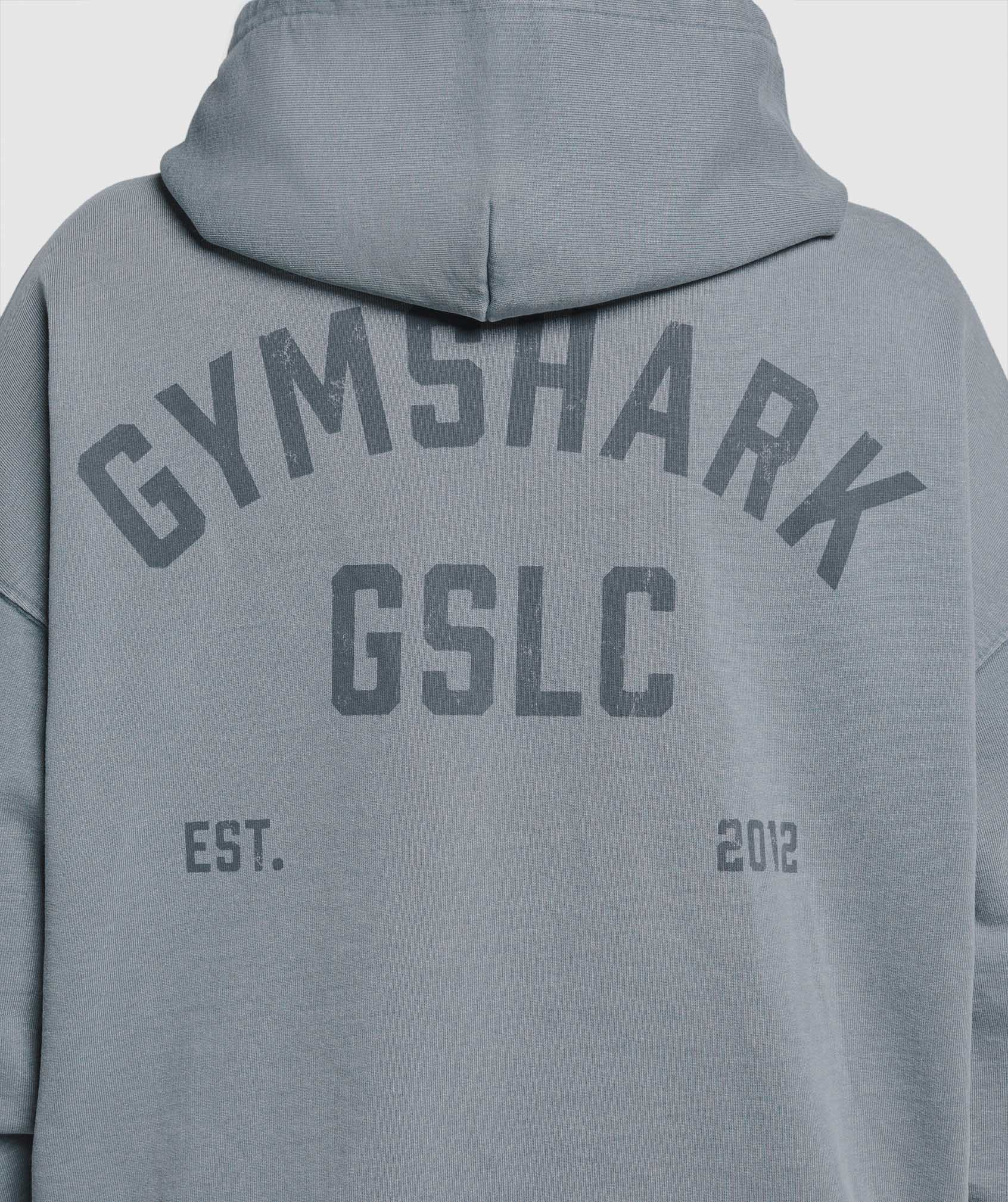 gymshark-gslc-graphic-oversized-hoodie-iron-blue-ss25