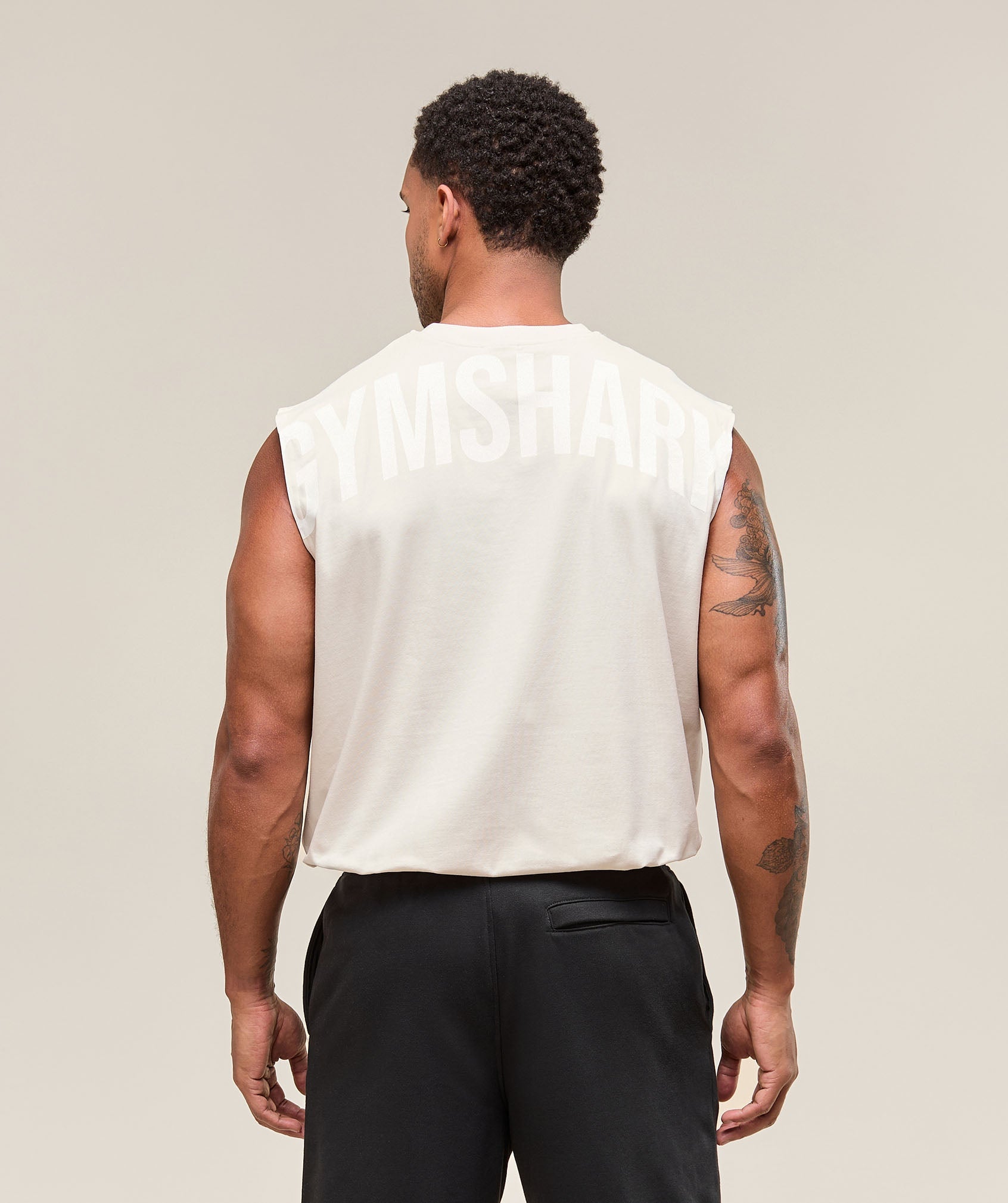 gymshark-power-cut-off-tank-oat-white-ss25