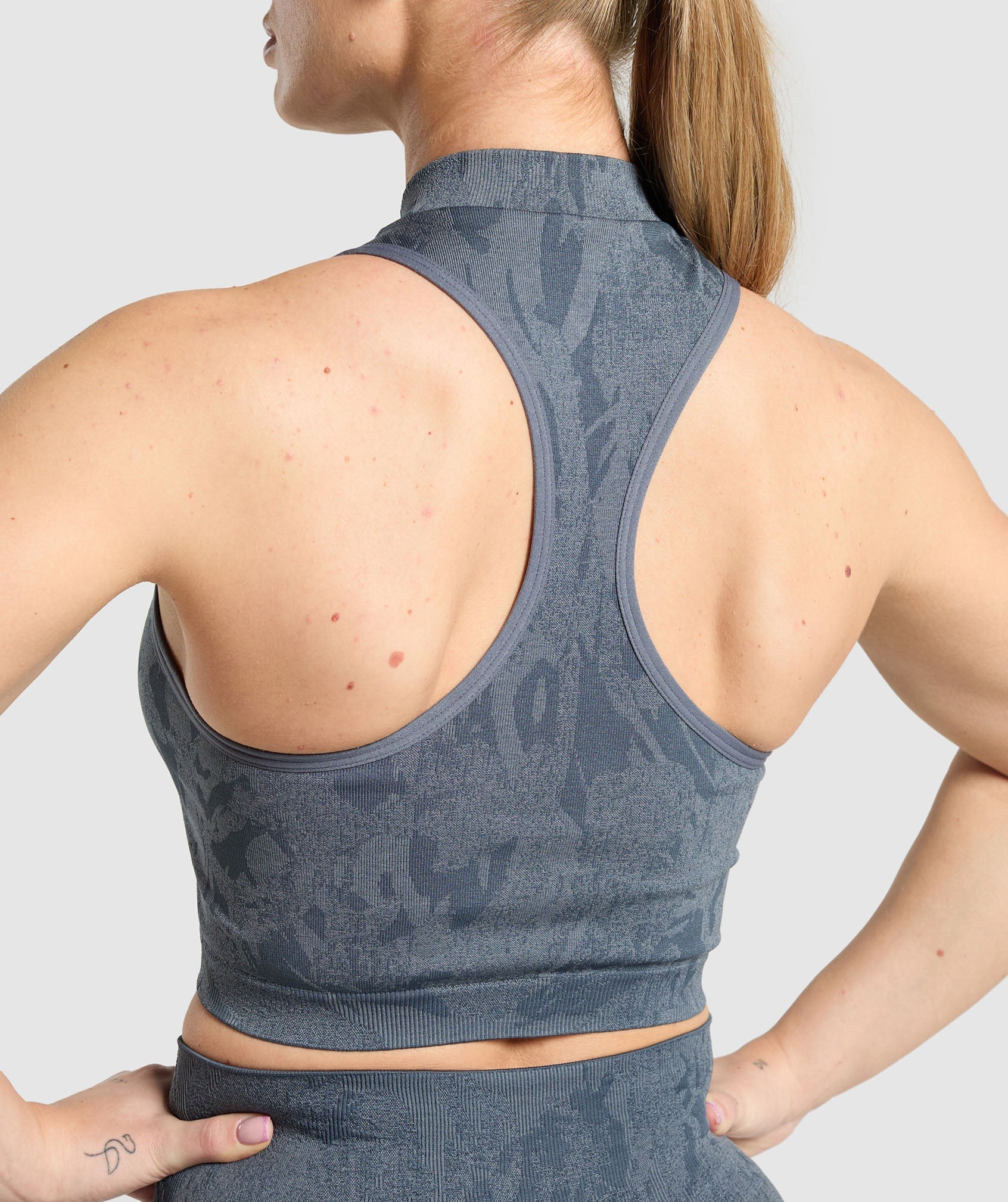 gymshark-adapt-camo-seamless-zip-up-crop-top-titanium-blue-denim-grey-ss25