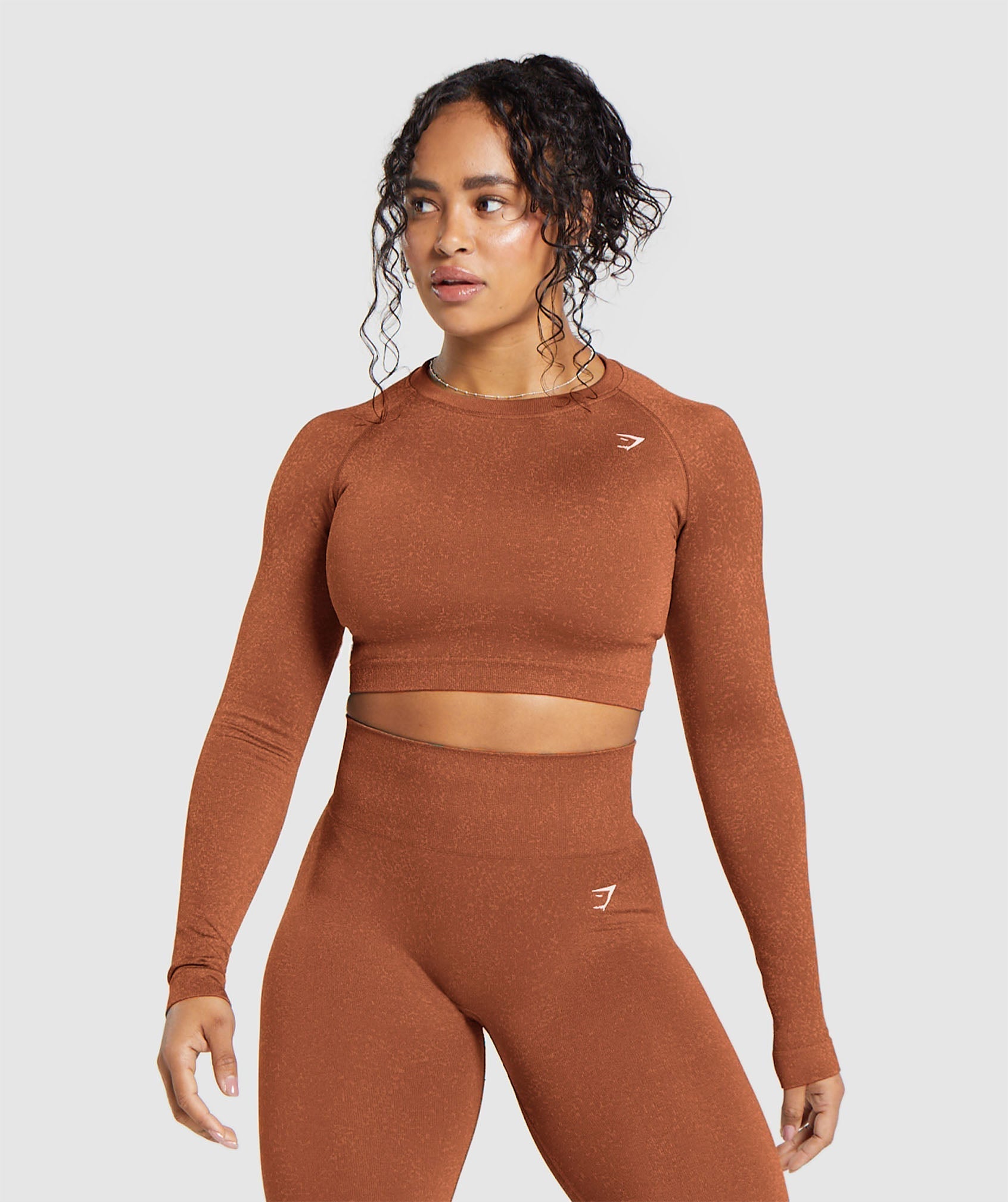 gymshark-adapt-fleck-seamless-long-sleeve-crop-top-copper-brown-terracotta-orange-ss24