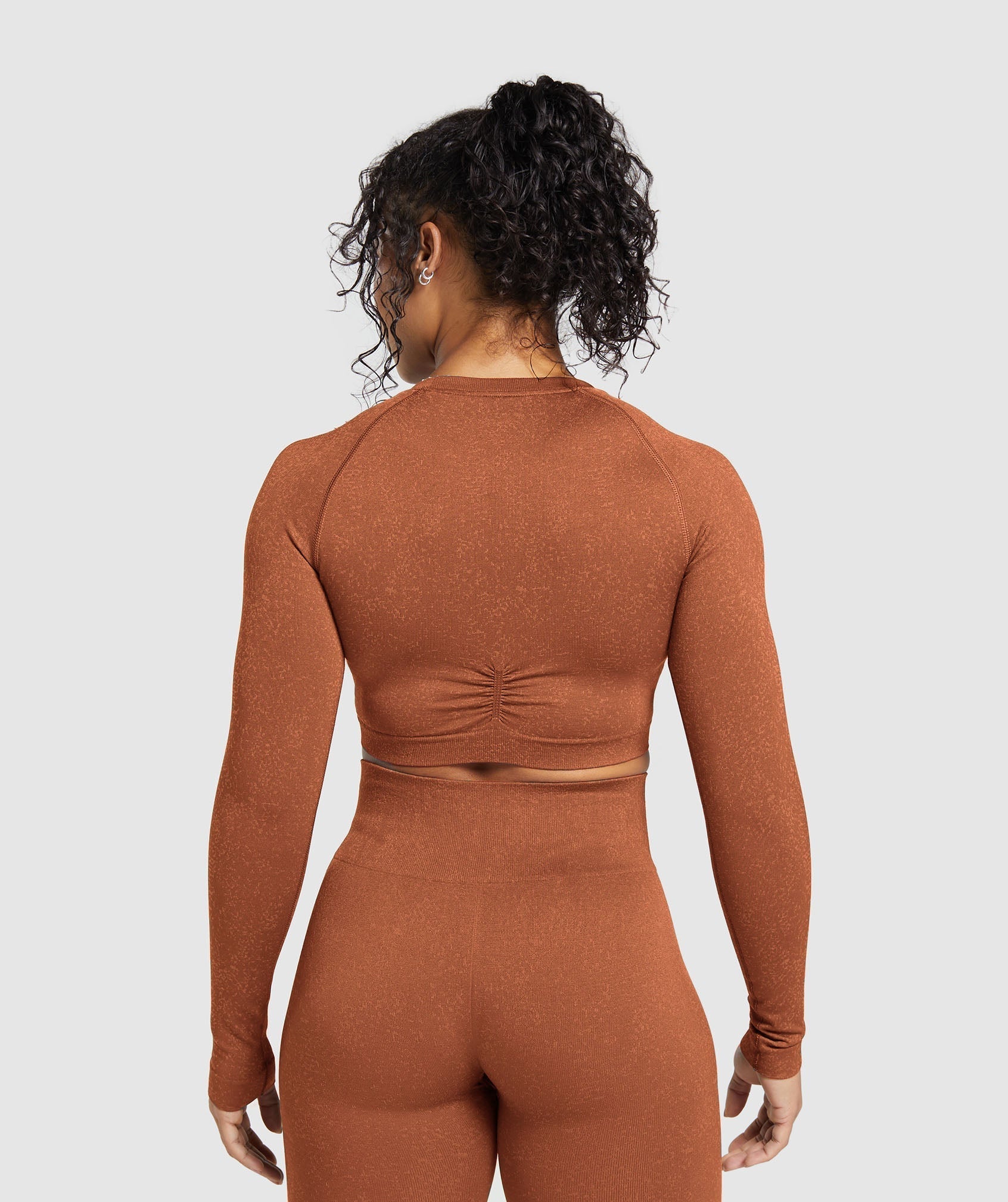 gymshark-adapt-fleck-seamless-long-sleeve-crop-top-copper-brown-terracotta-orange-ss24