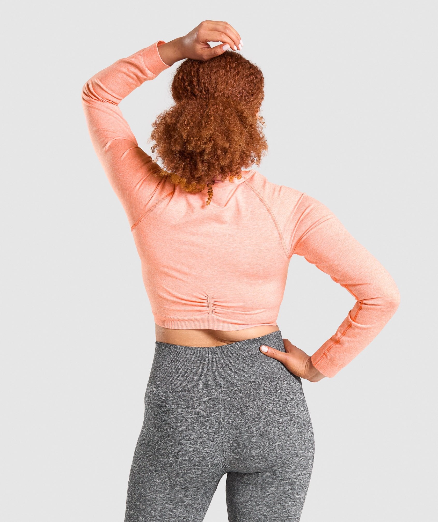 gymshark-adapt-marl-seamless-long-sleeve-crop-top-orange
