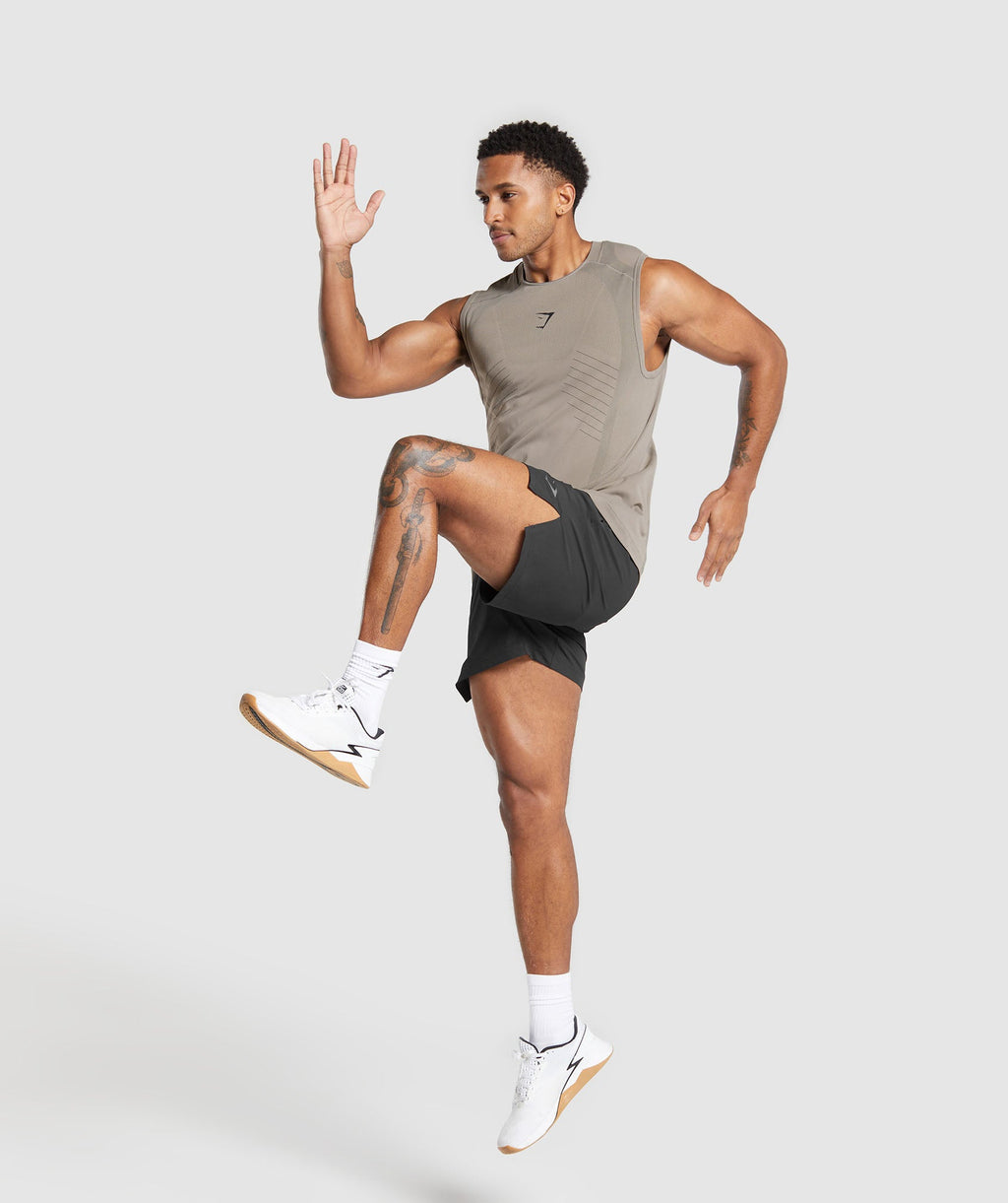 gymshark-apex-seamless-tank-linen-brown-black-ss24