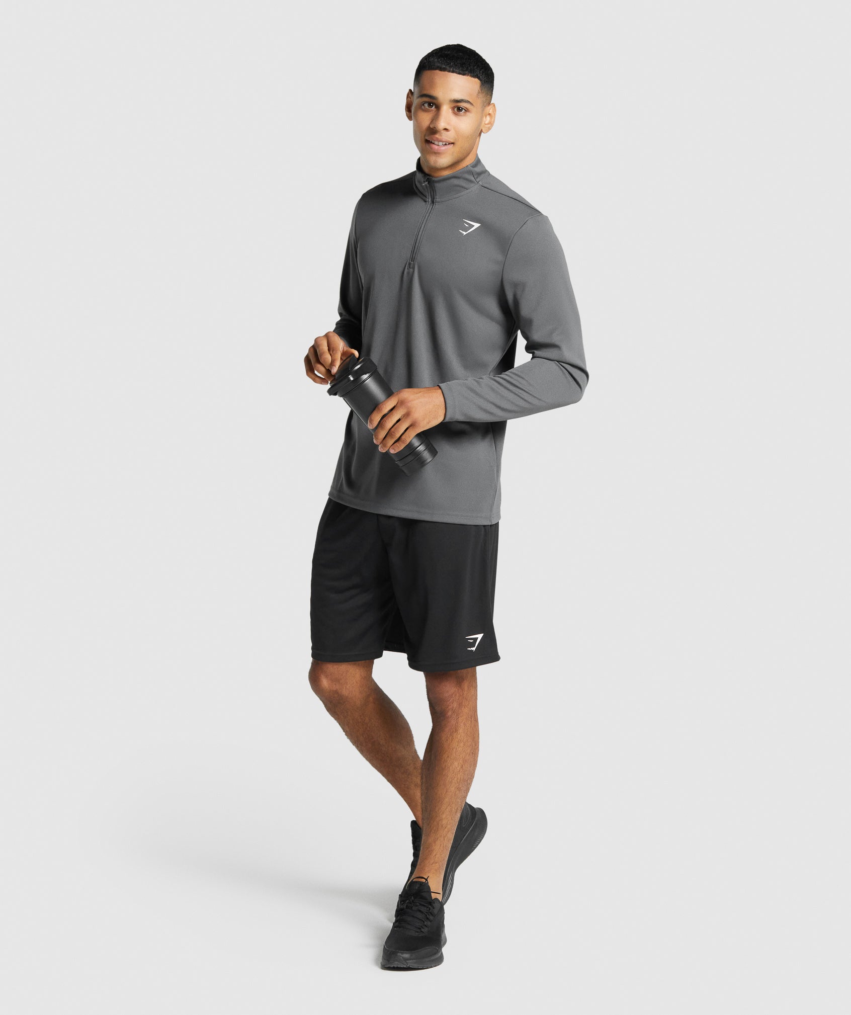 gymshark-arrival-1-4-zip-pullover-charcoal-logo