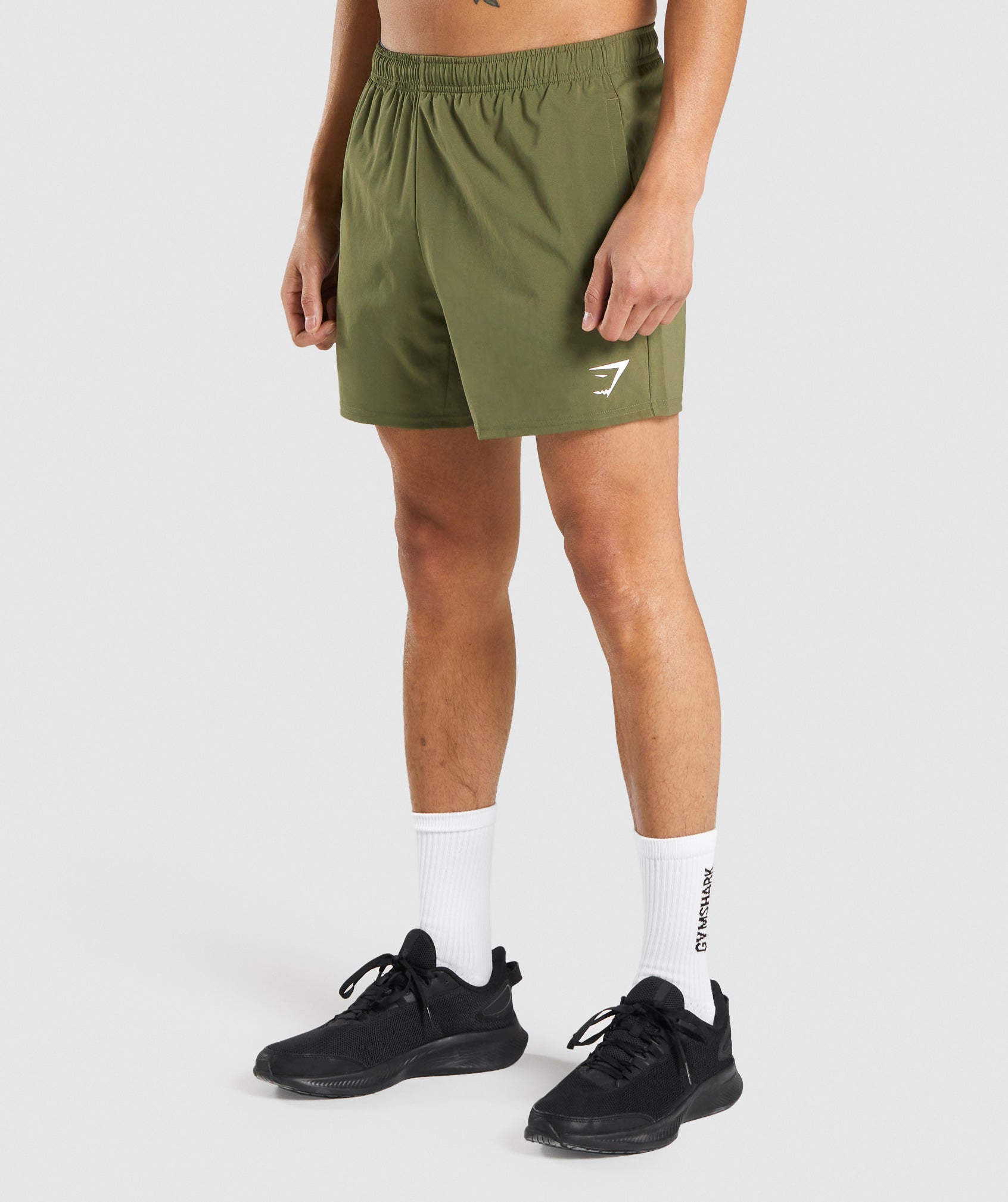 gymshark-arrival-5-shorts-dark-green-white-logo