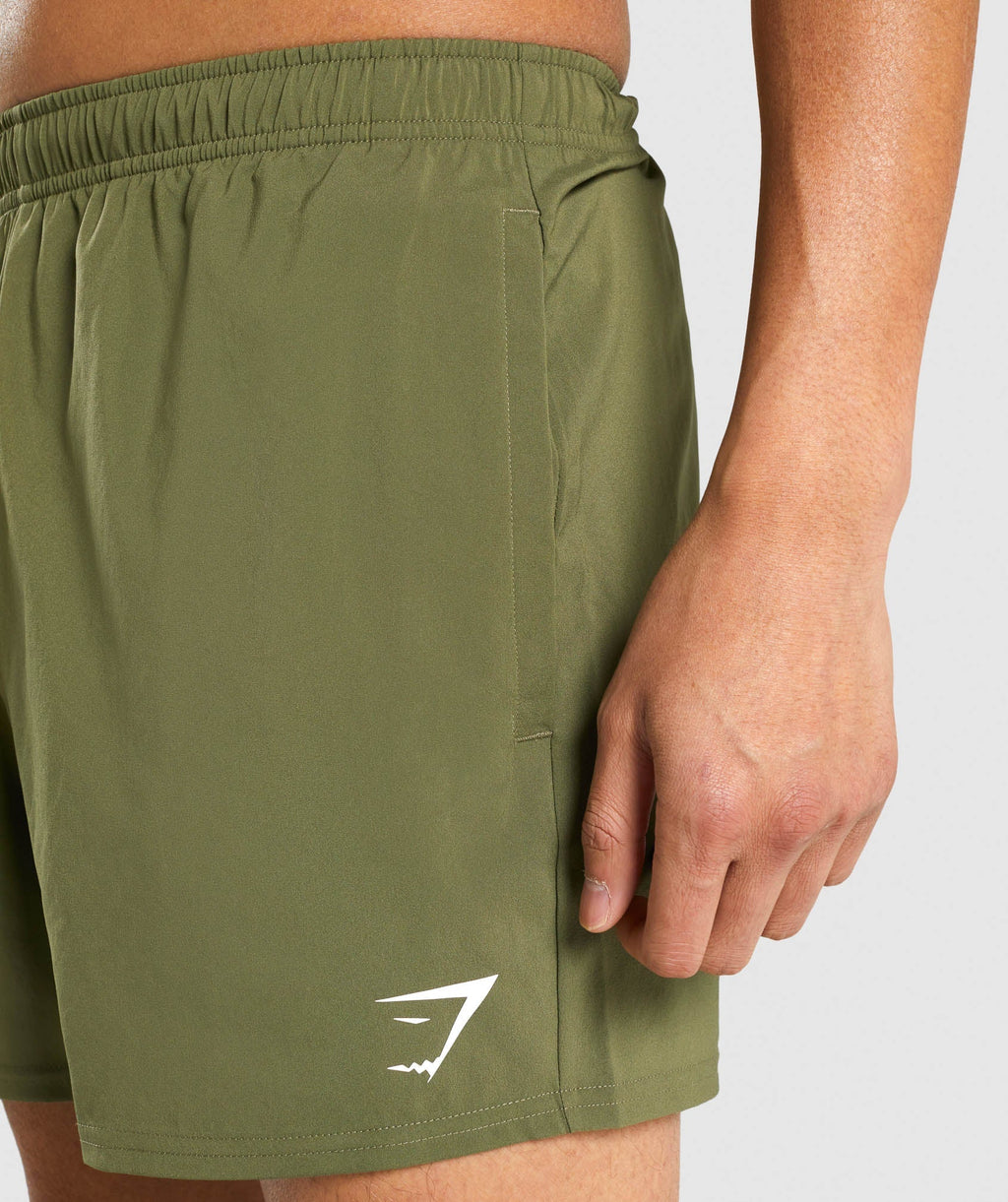 gymshark-arrival-5-shorts-dark-green-white-logo