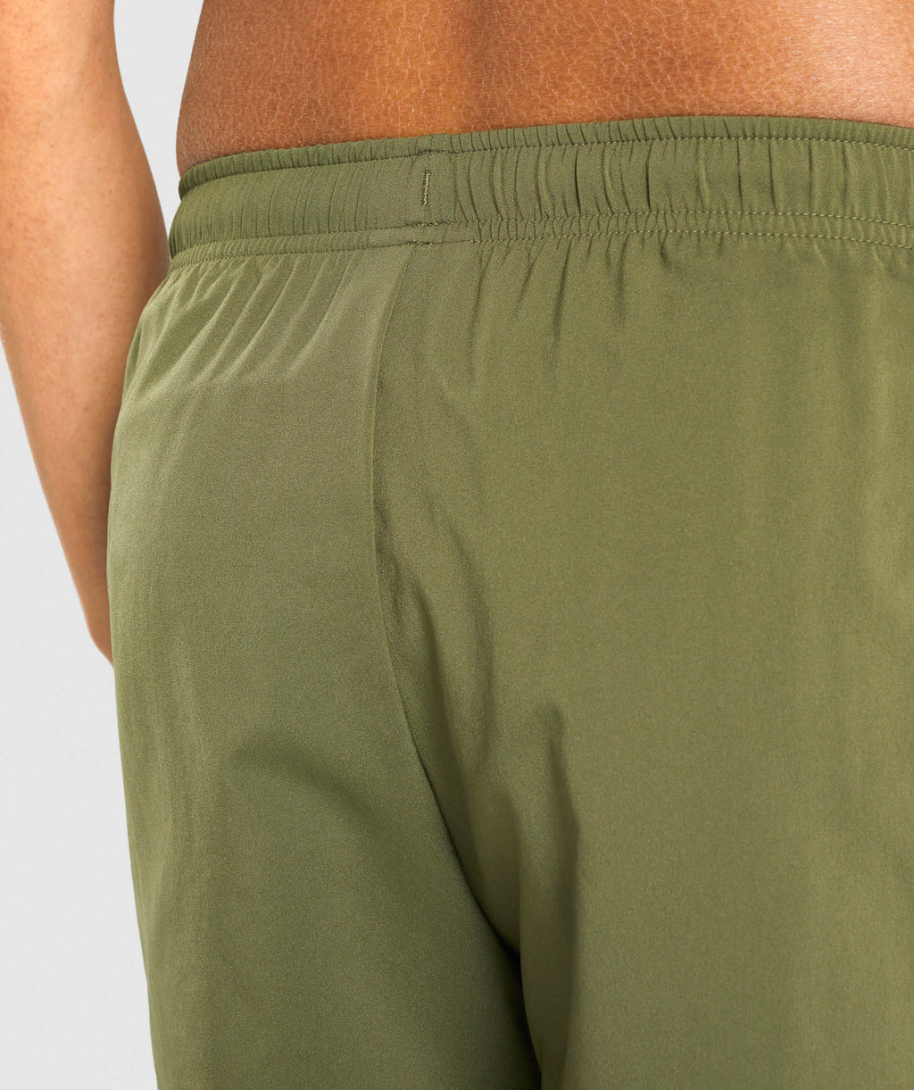 gymshark-arrival-5-shorts-dark-green-white-logo