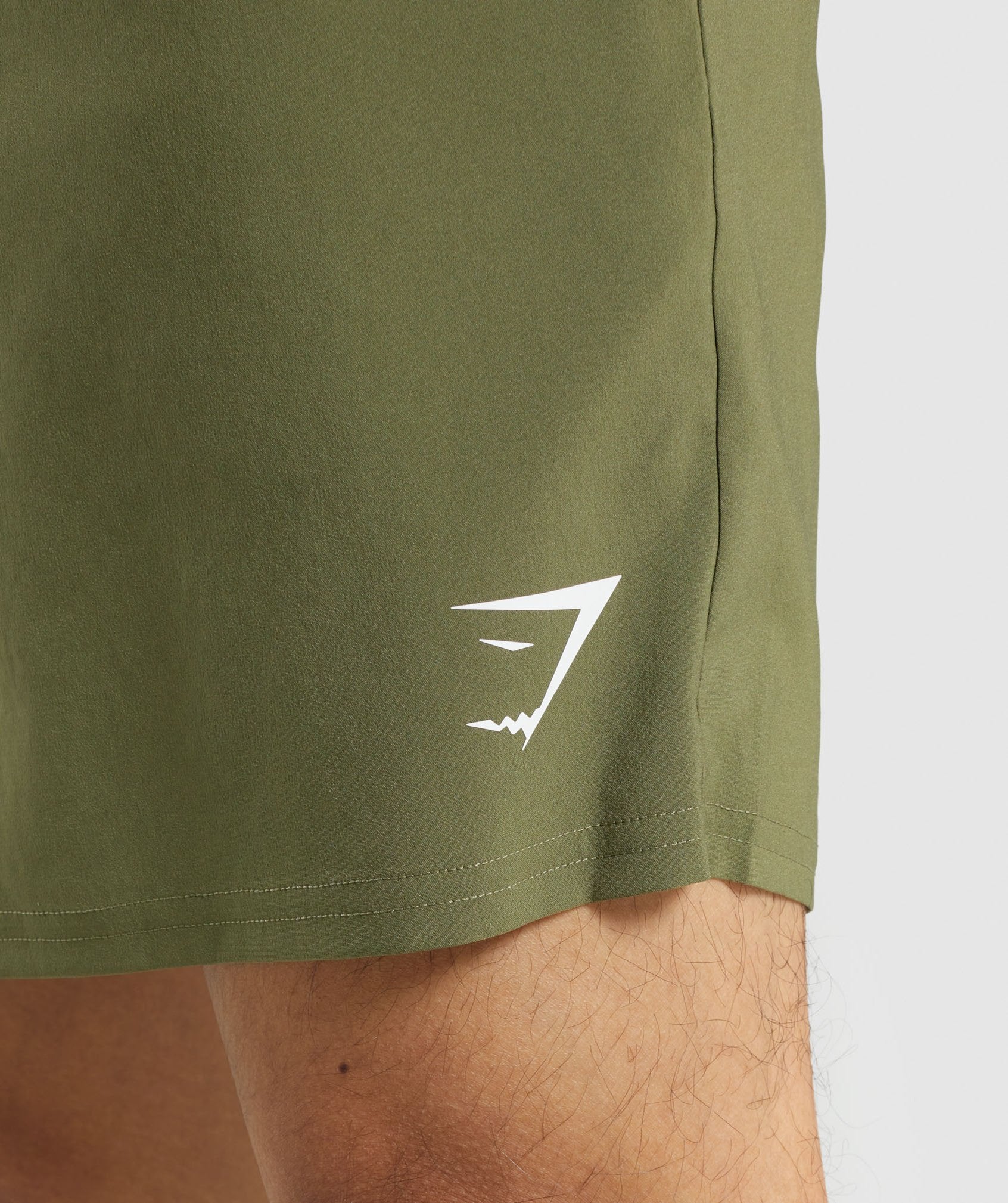 gymshark-arrival-shorts-dark-green-white-logo