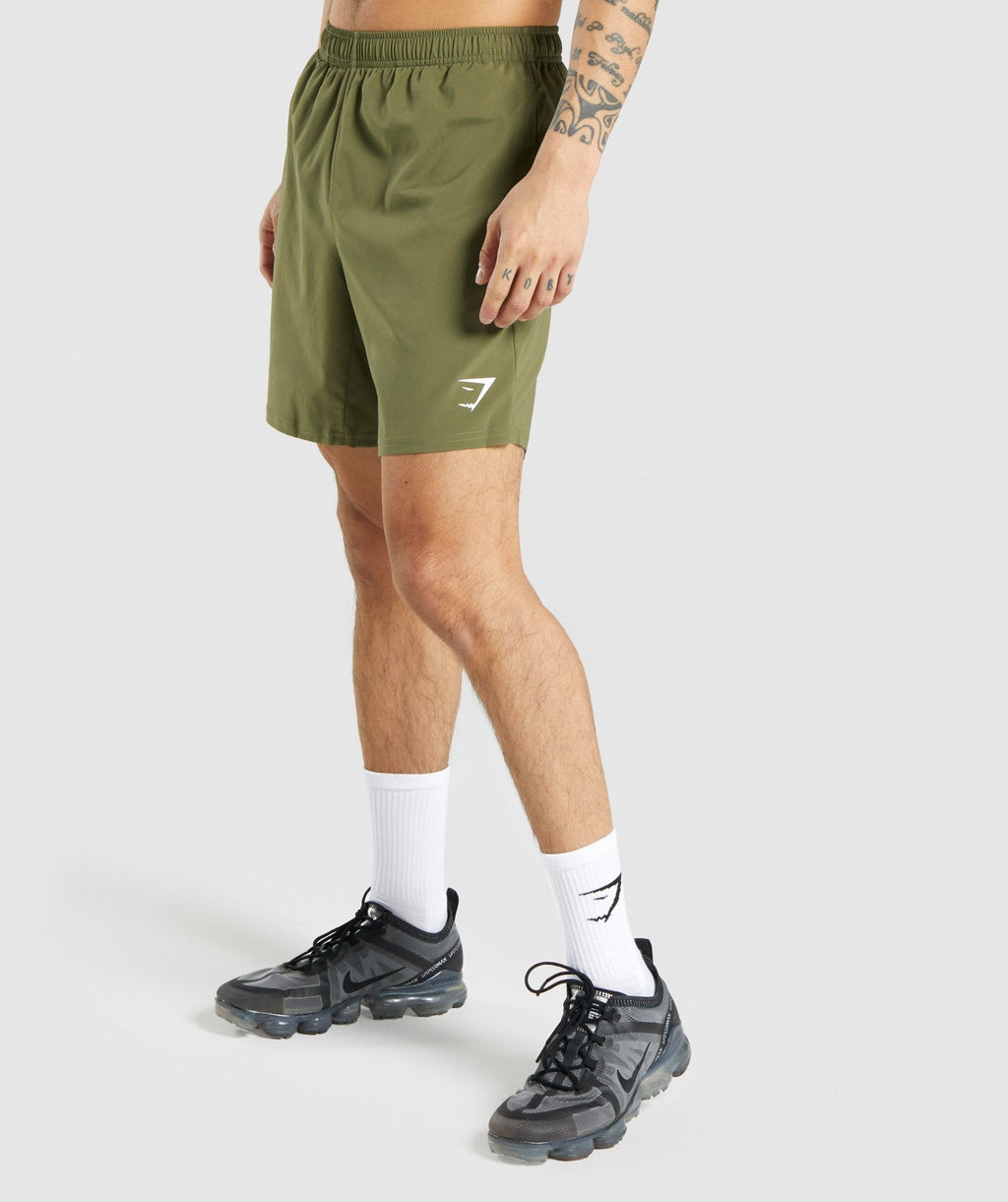 gymshark-arrival-shorts-dark-green-white-logo