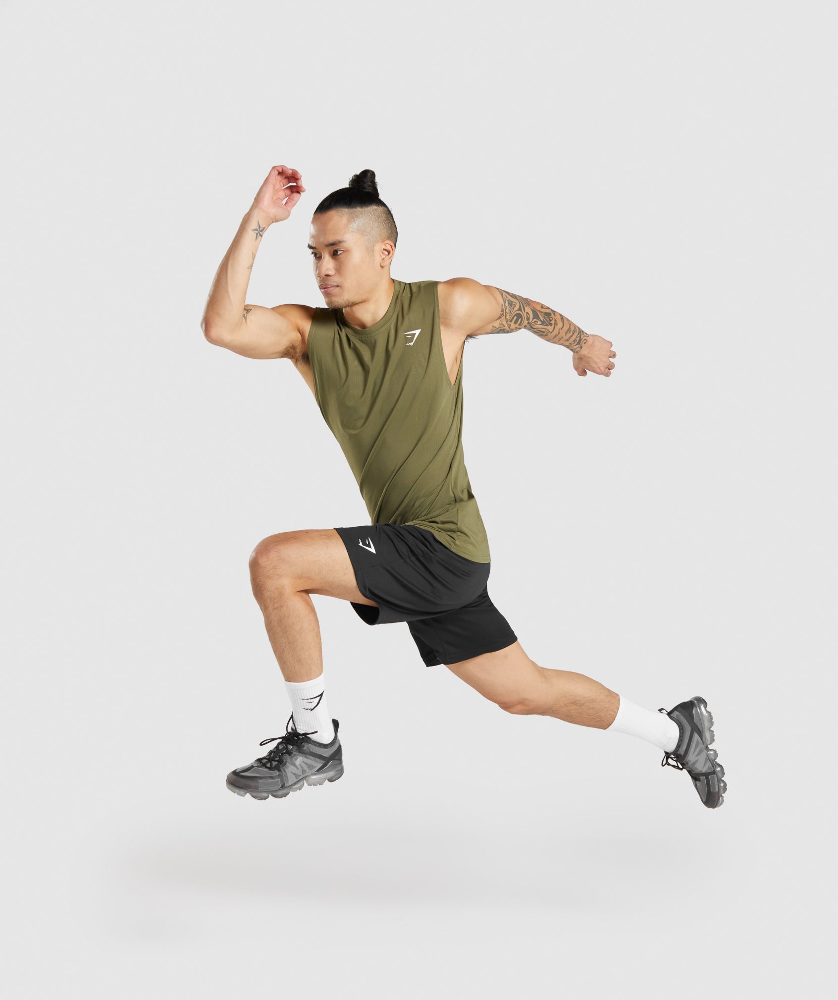 gymshark-arrival-sleeveless-tee-dark-green