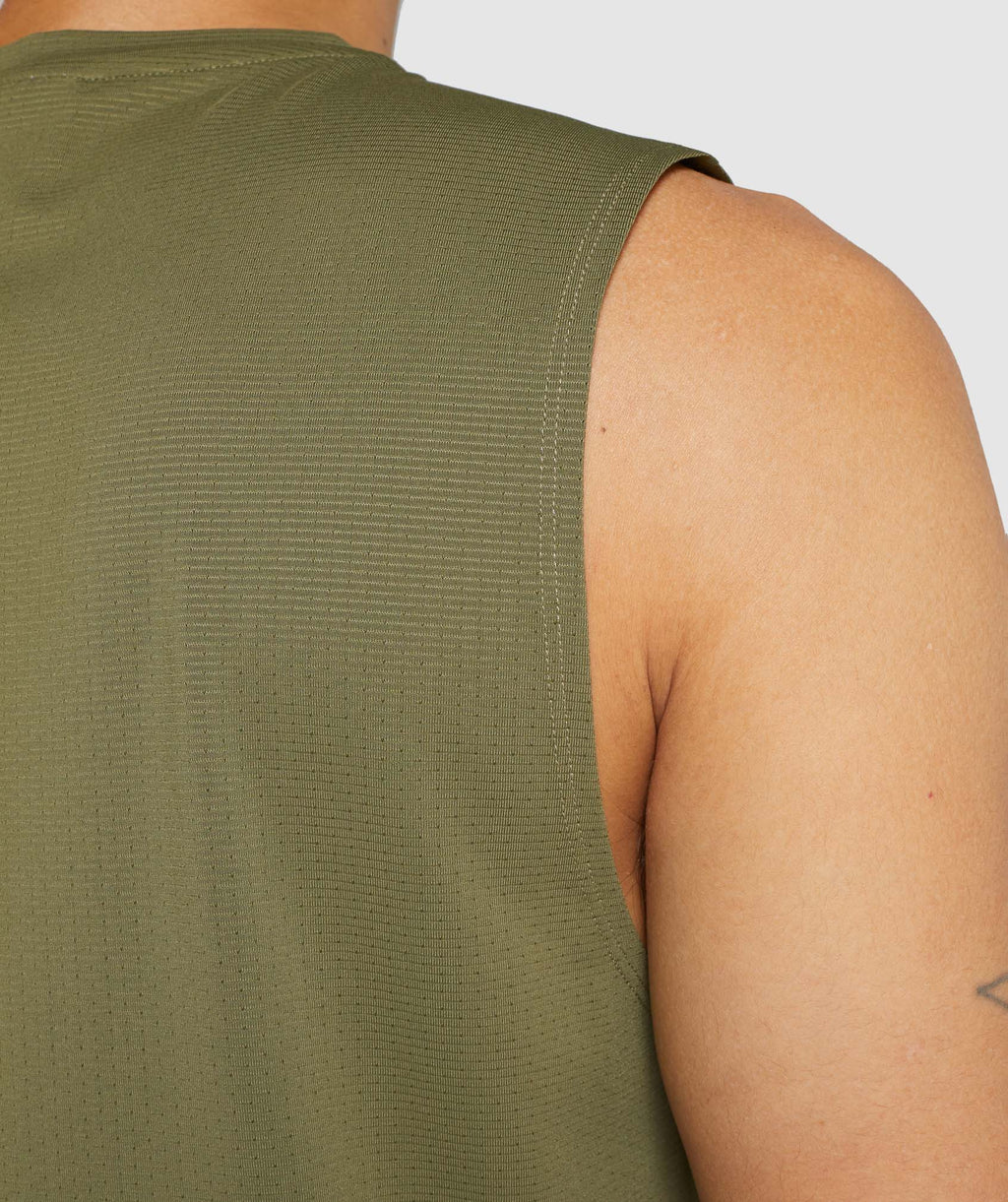 gymshark-arrival-sleeveless-tee-dark-green