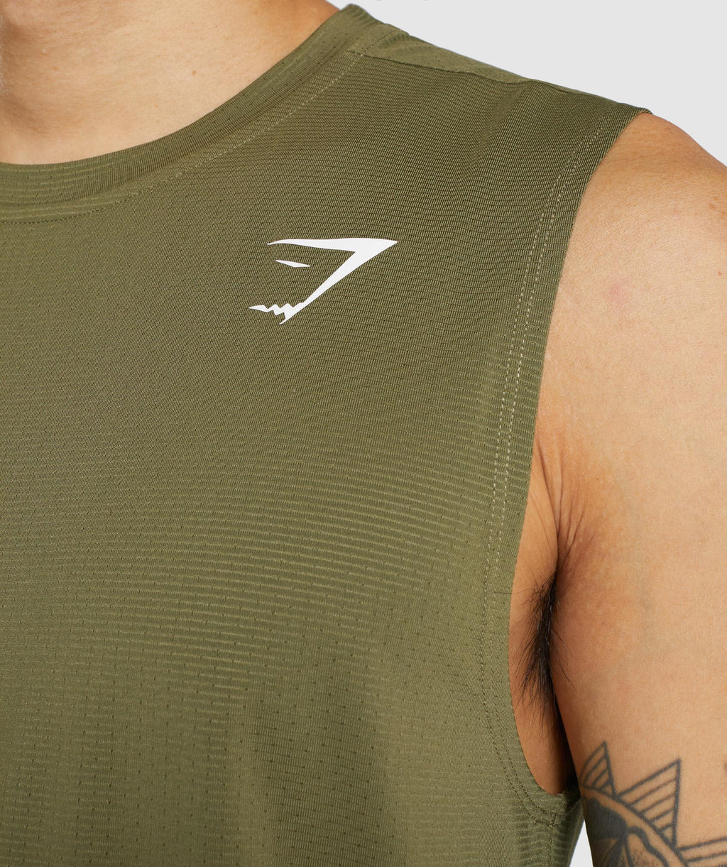 gymshark-arrival-sleeveless-tee-dark-green