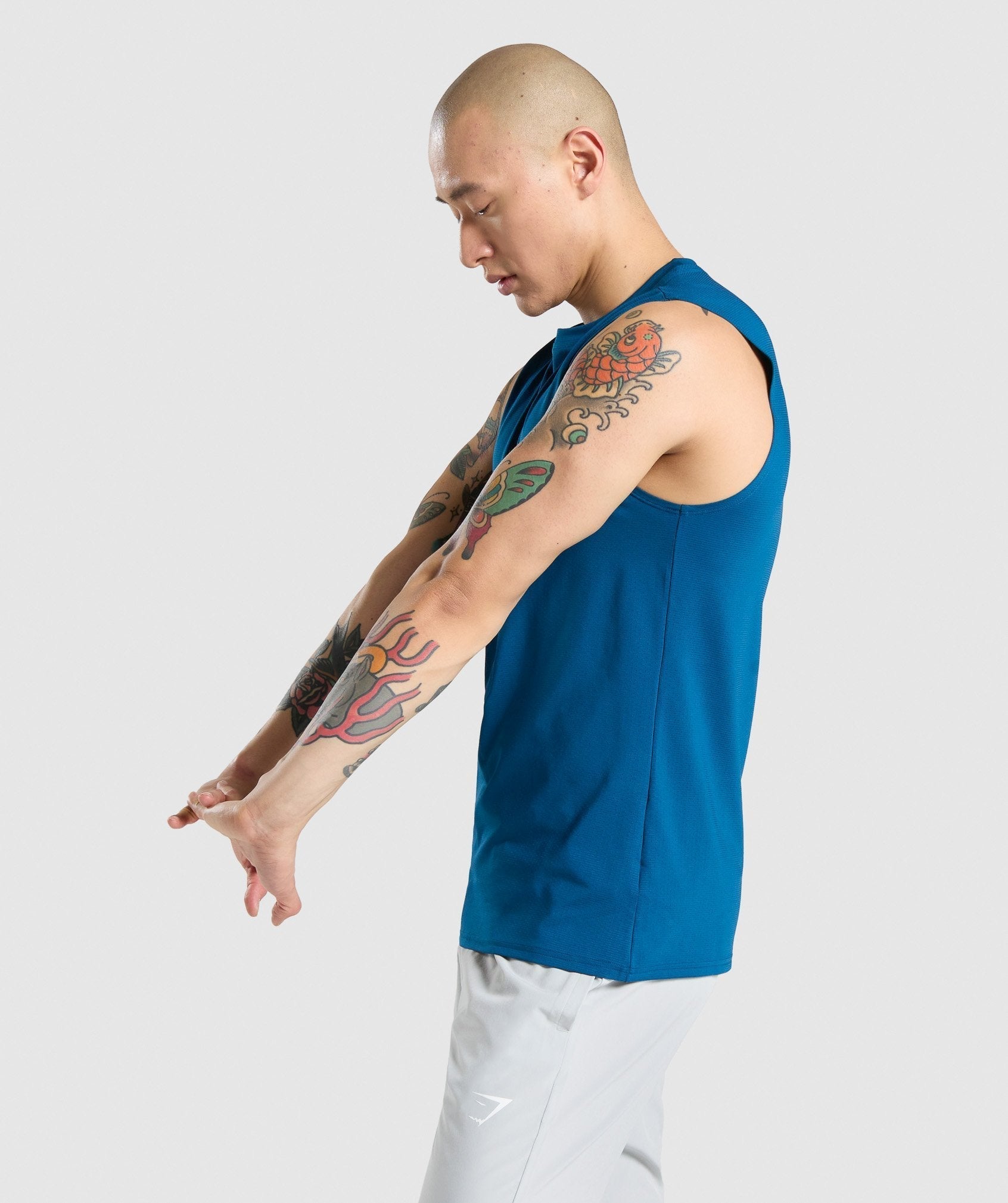 gymshark-arrival-sleeveless-tee-petrol-blue-aw21