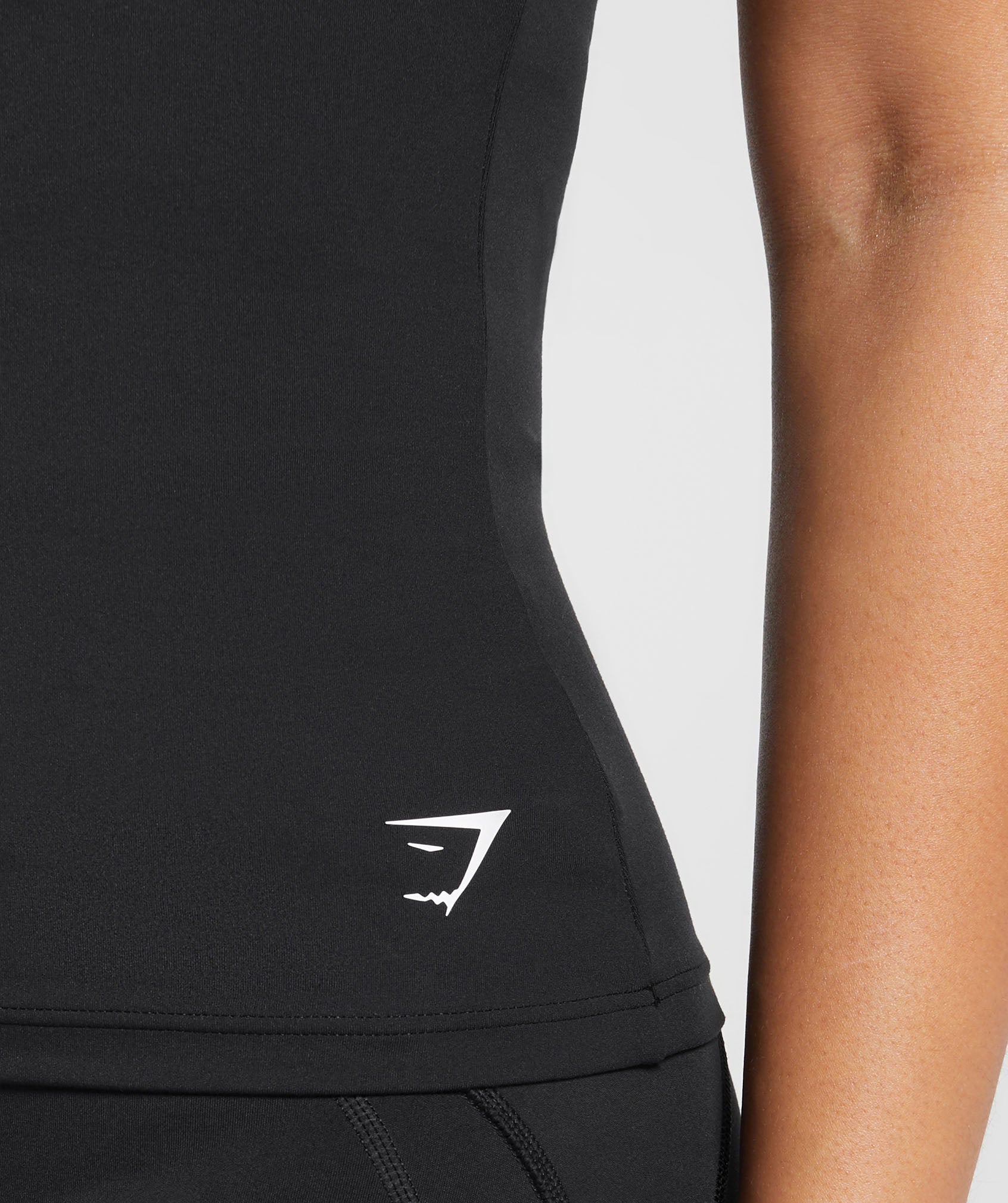 gymshark-asymmetric-shelf-tank-black-ss24