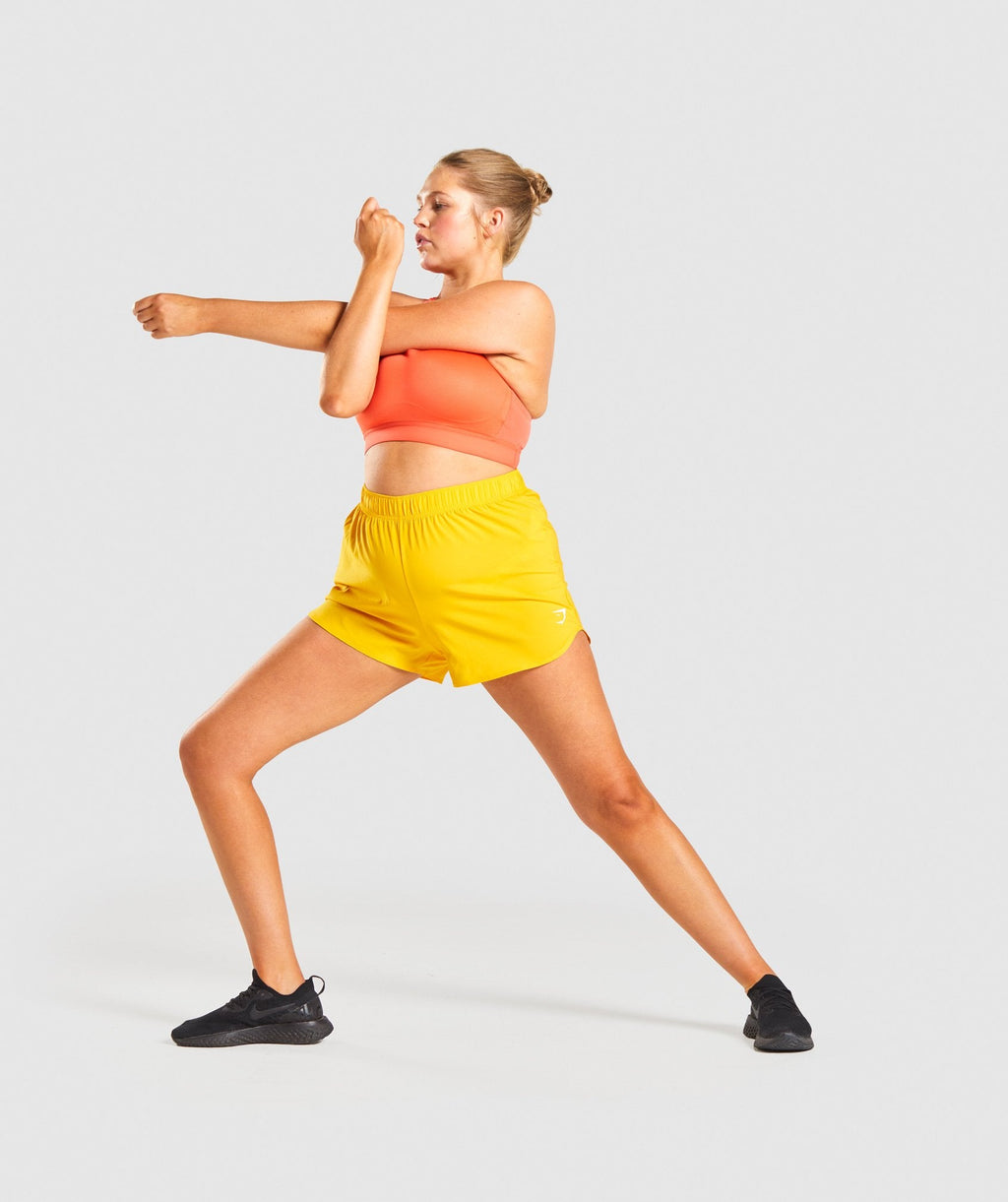 gymshark-essential-loose-training-shorts-yellow