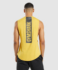 gymshark-bold-drop-arm-tank-medallion-yellow-ss22