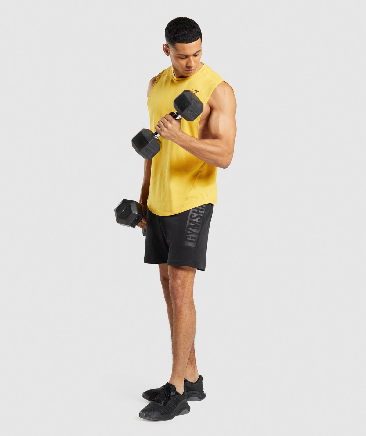 gymshark-bold-drop-arm-tank-medallion-yellow-ss22