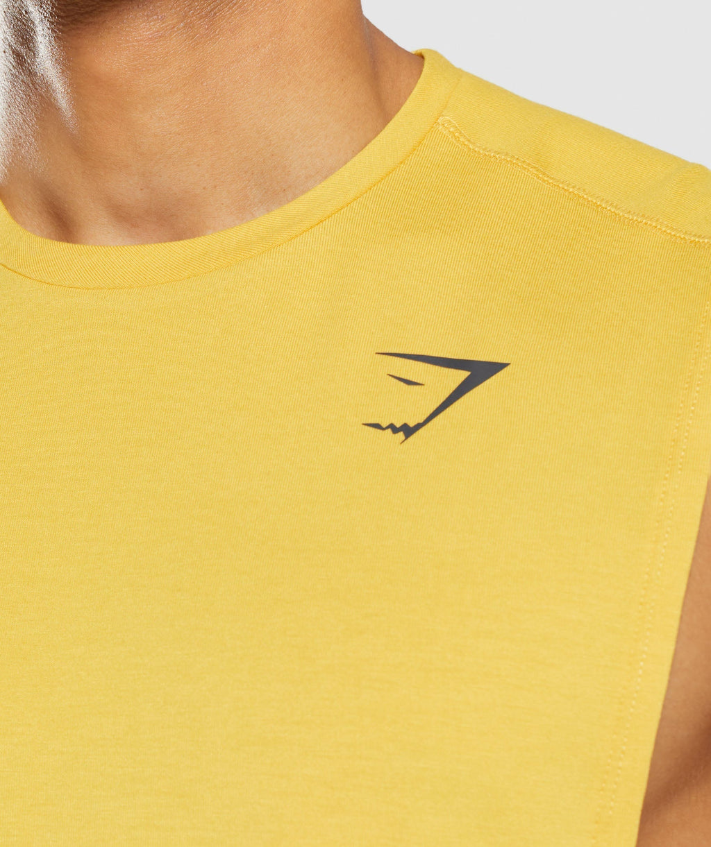 gymshark-bold-drop-arm-tank-medallion-yellow-ss22