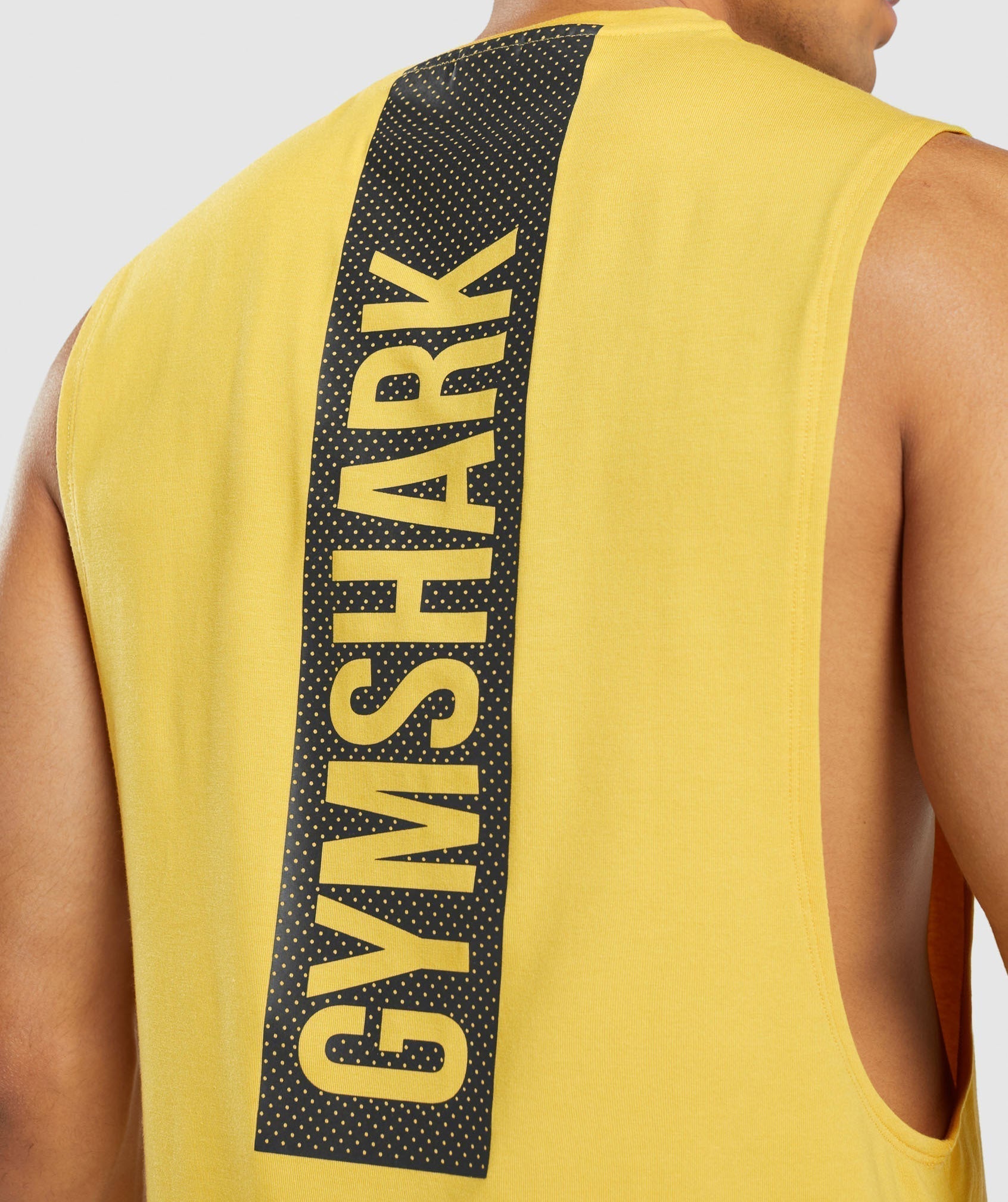 gymshark-bold-drop-arm-tank-medallion-yellow-ss22