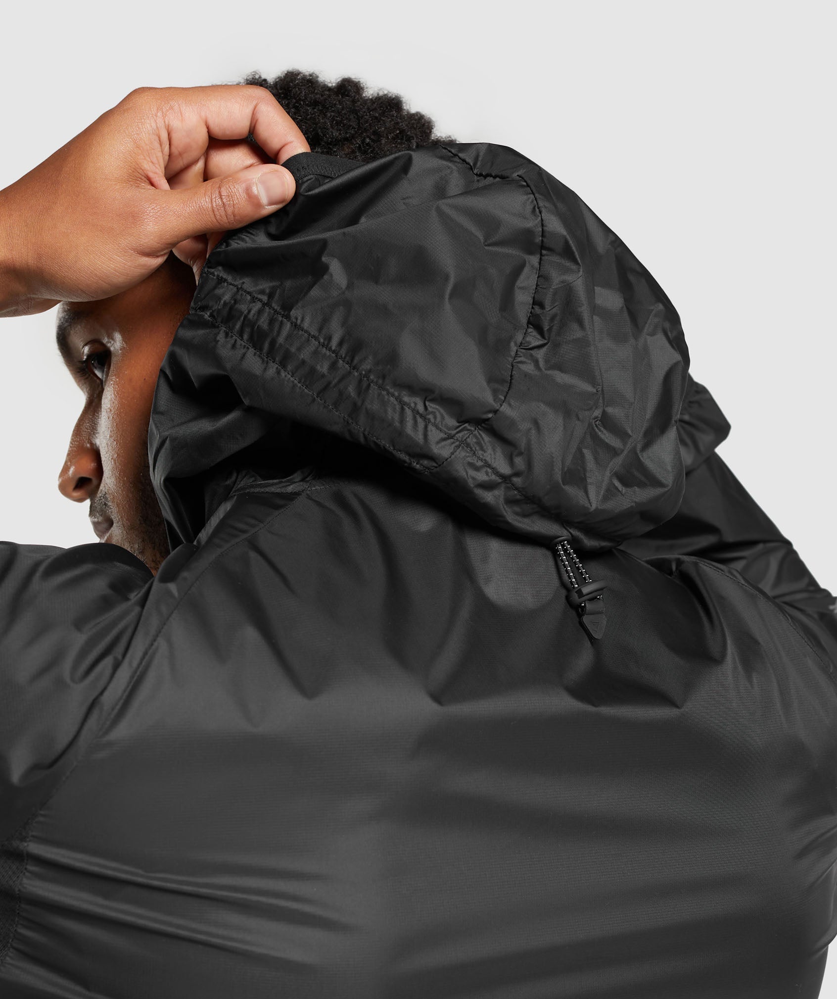 gymshark-bude-packaway-shell-black-ss24