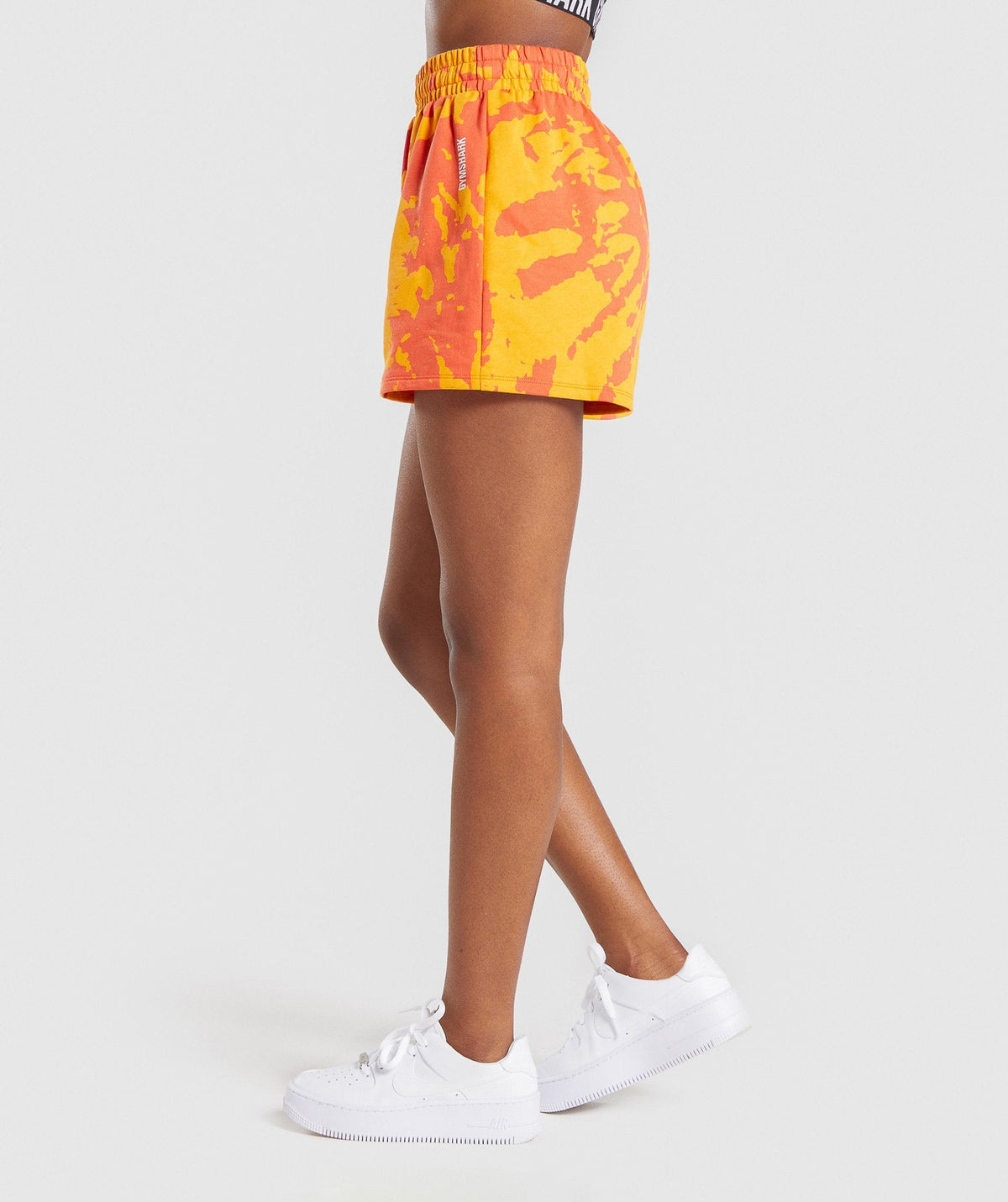 gymshark-colour-burst-shorts-orange-print