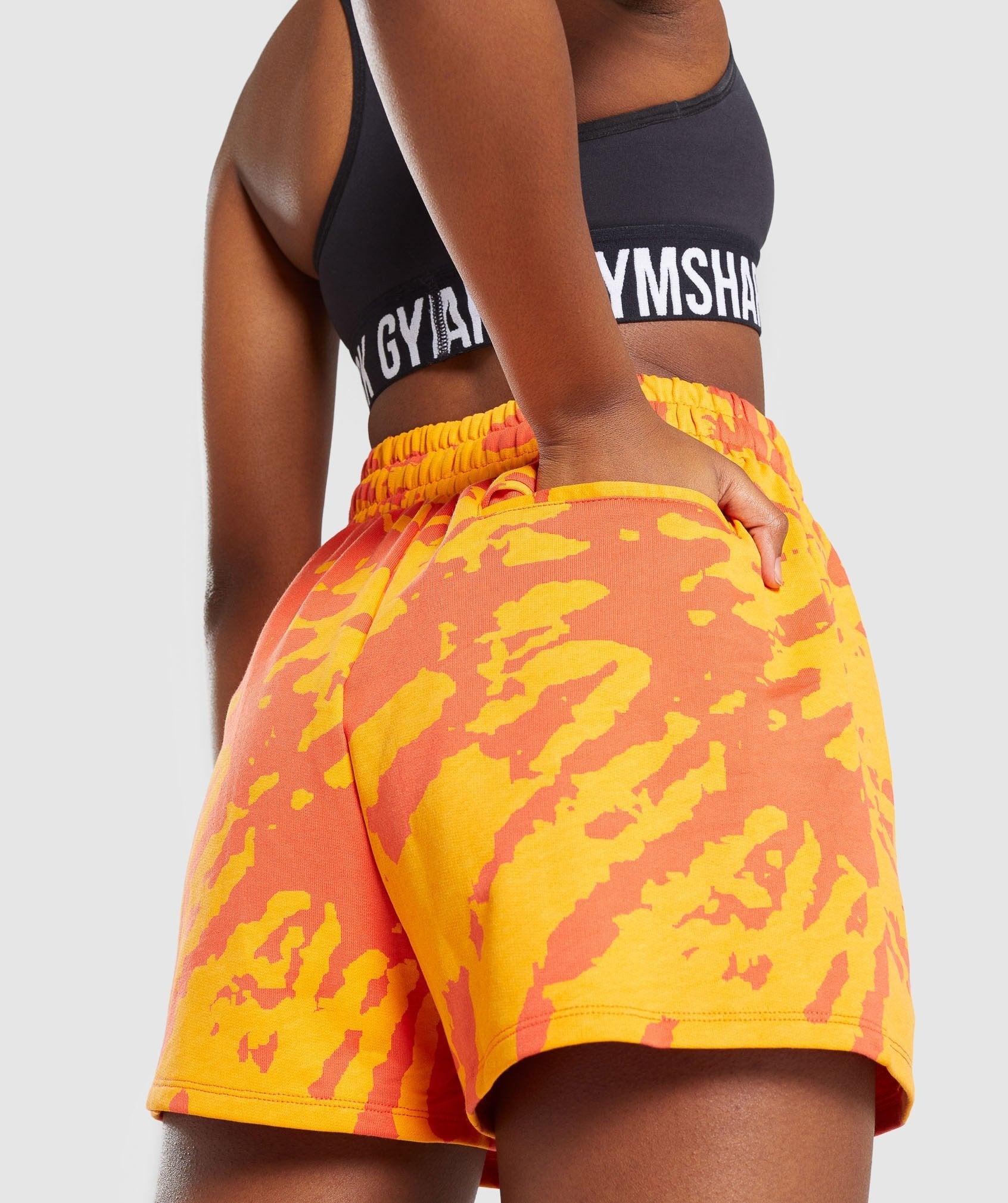 gymshark-colour-burst-shorts-orange-print