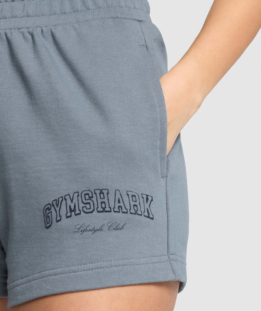 gymshark-campus-classics-graphic-sweat-shorts-iron-blue-ss25