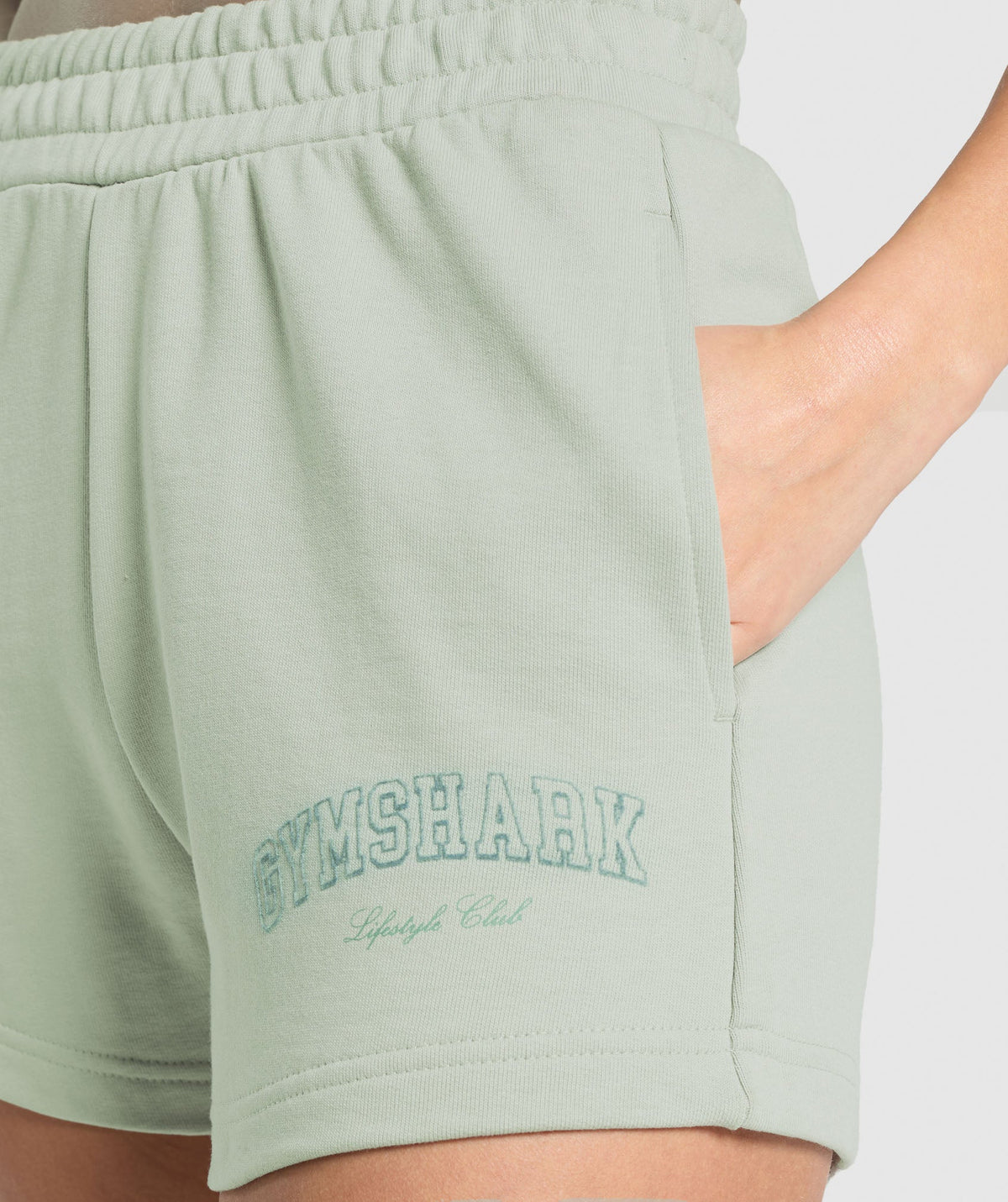 gymshark-campus-classics-graphic-sweat-shorts-stone-grey-ss25