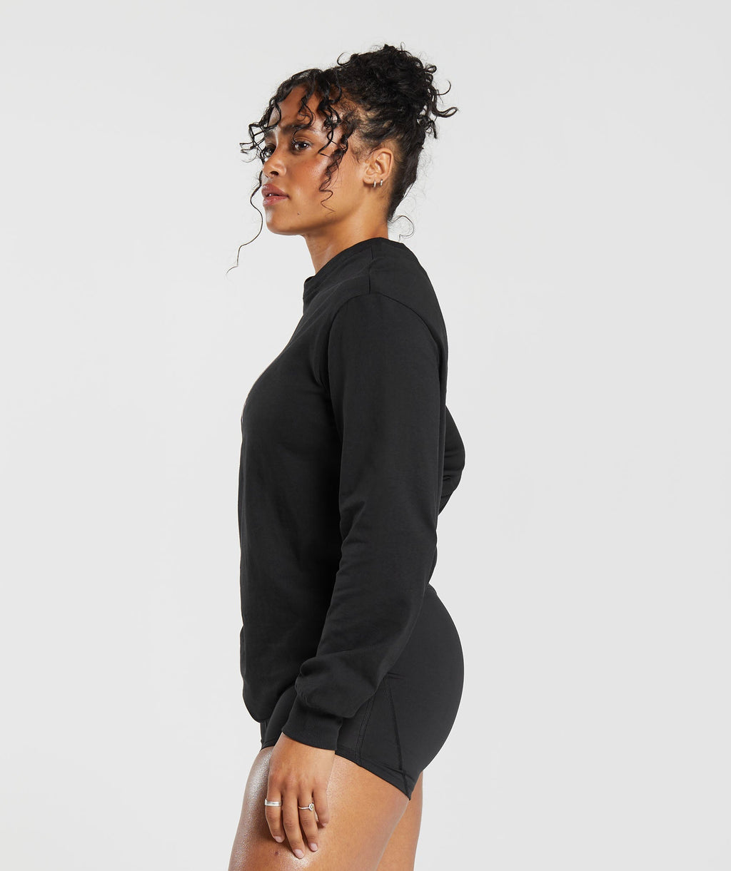 gymshark-cherub-graphic-long-sleeve-top-black-aw23