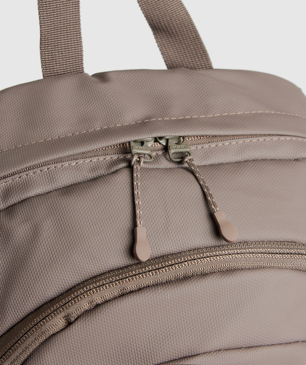 gymshark-coated-pursuit-backpack-camo-brown-cement-brown-aw24