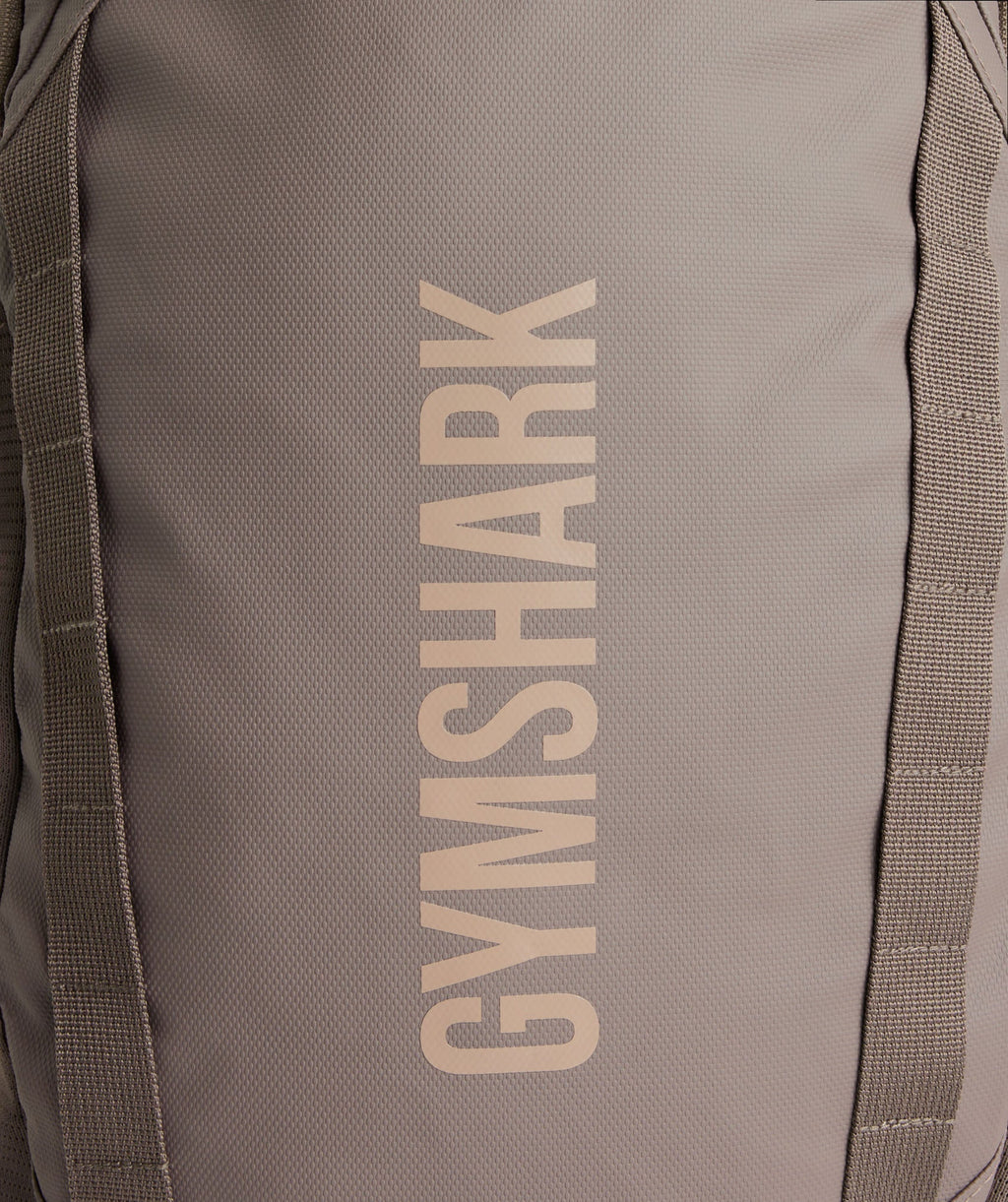 gymshark-coated-pursuit-backpack-camo-brown-cement-brown-aw24