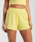 gymshark-cotton-graphic-shorts-lemon-yellow-ss24