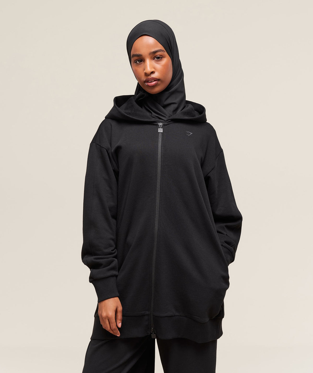 gymshark-covered-longline-zip-up-hoodie-black-ss25