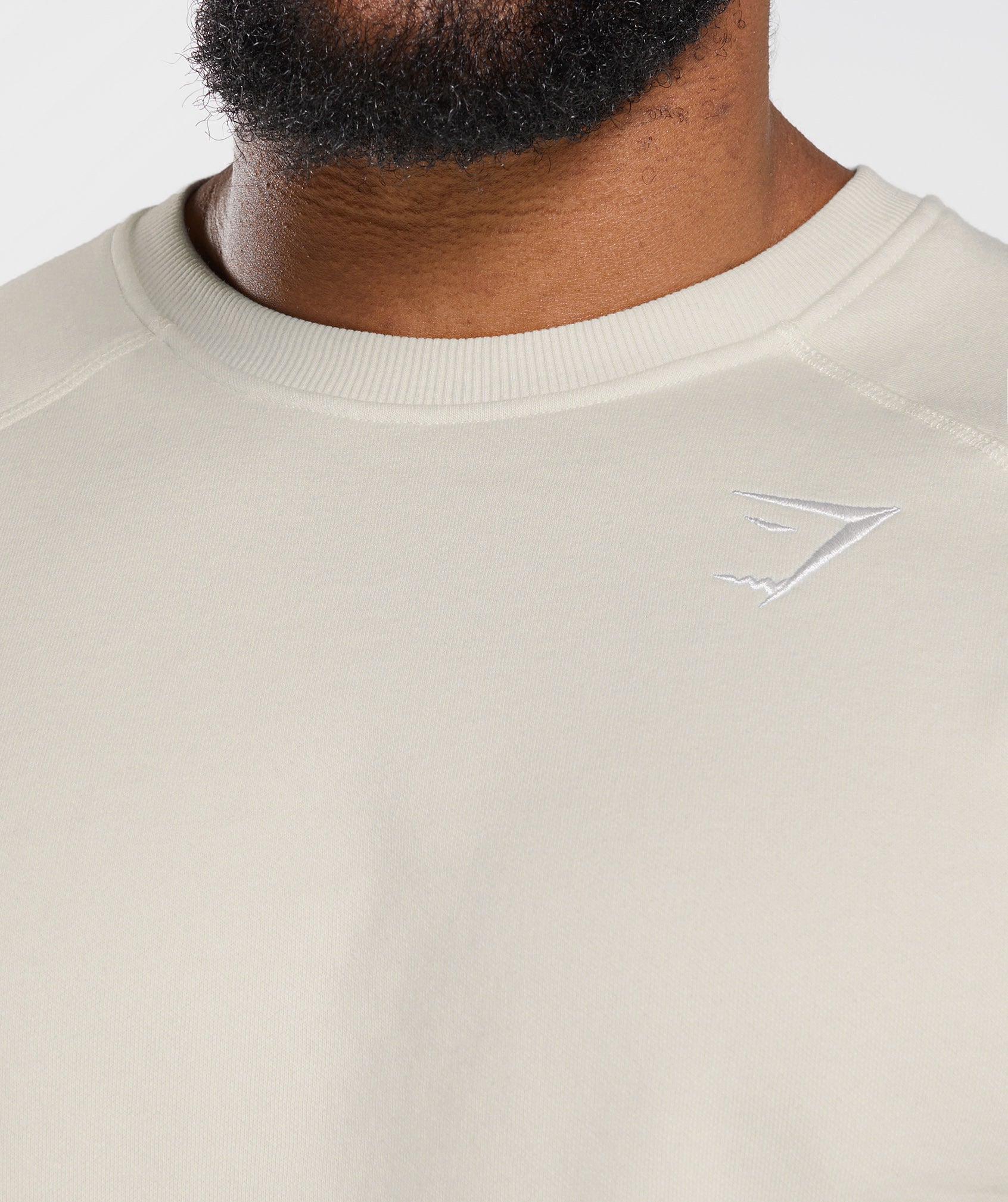gymshark-crest-sweatshirt-pebble-grey-aw22