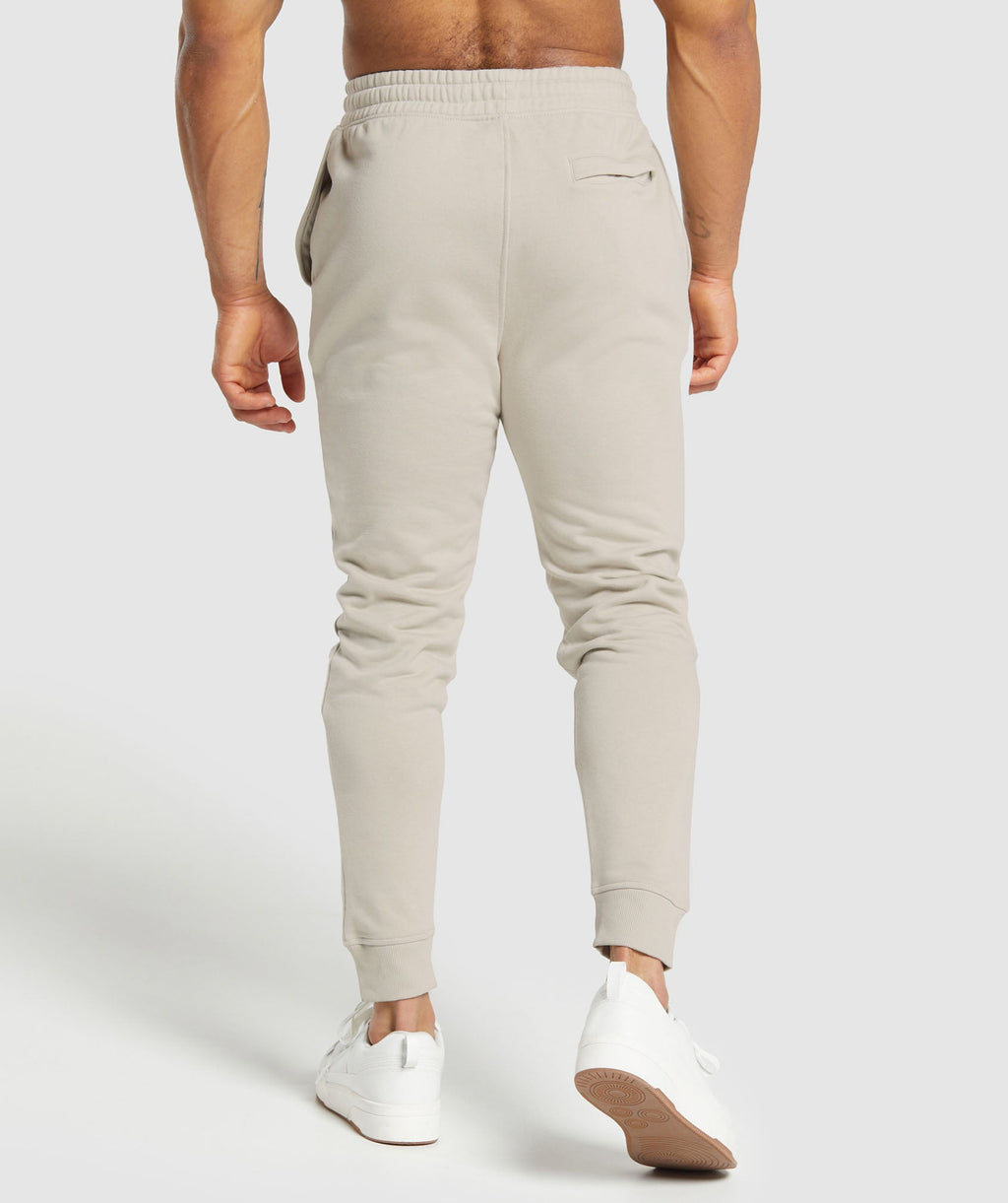 gymshark-crest-joggers-pebble-grey-aw22