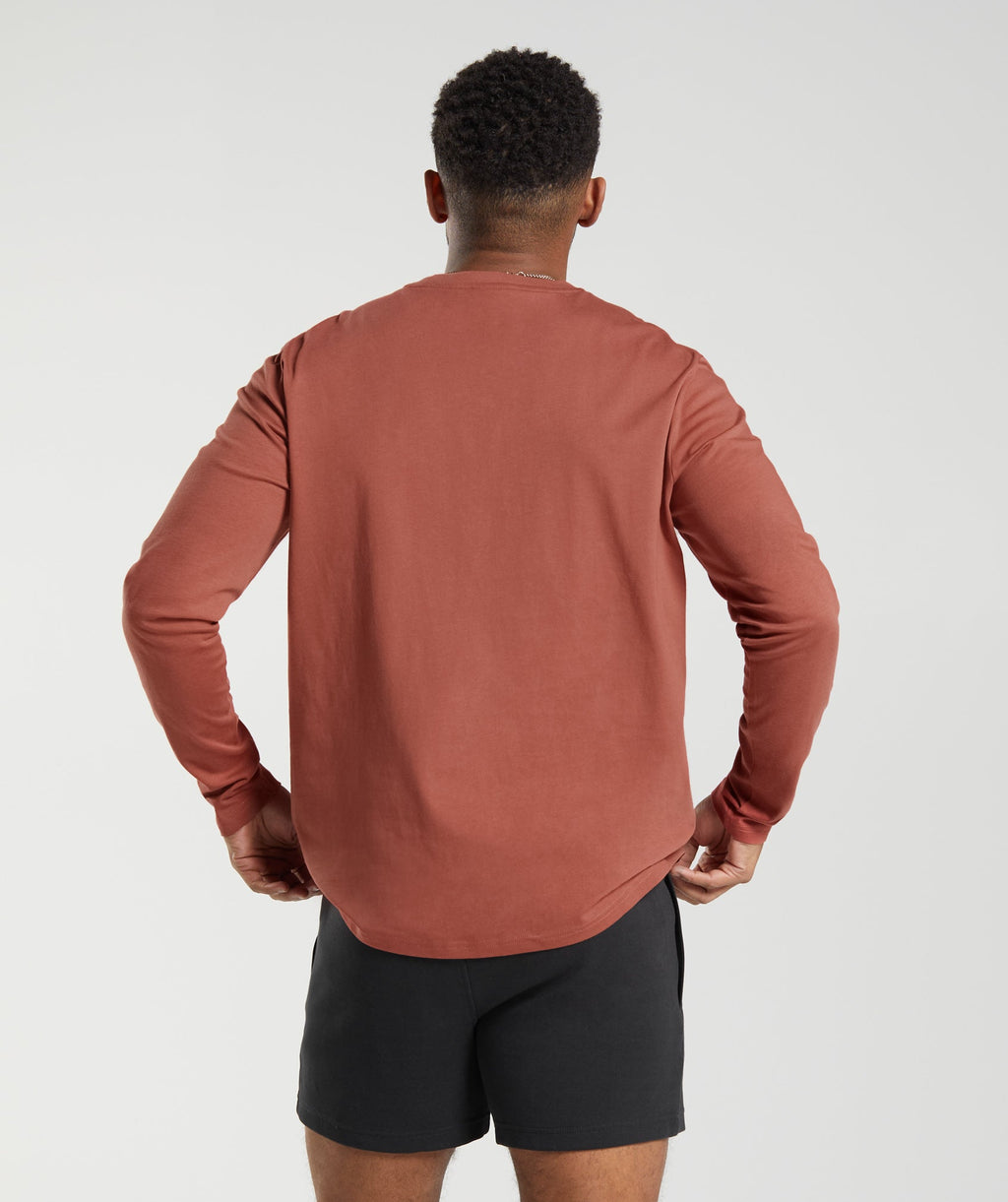 gymshark-crest-long-sleeve-t-shirt-persimmon-red-ss23