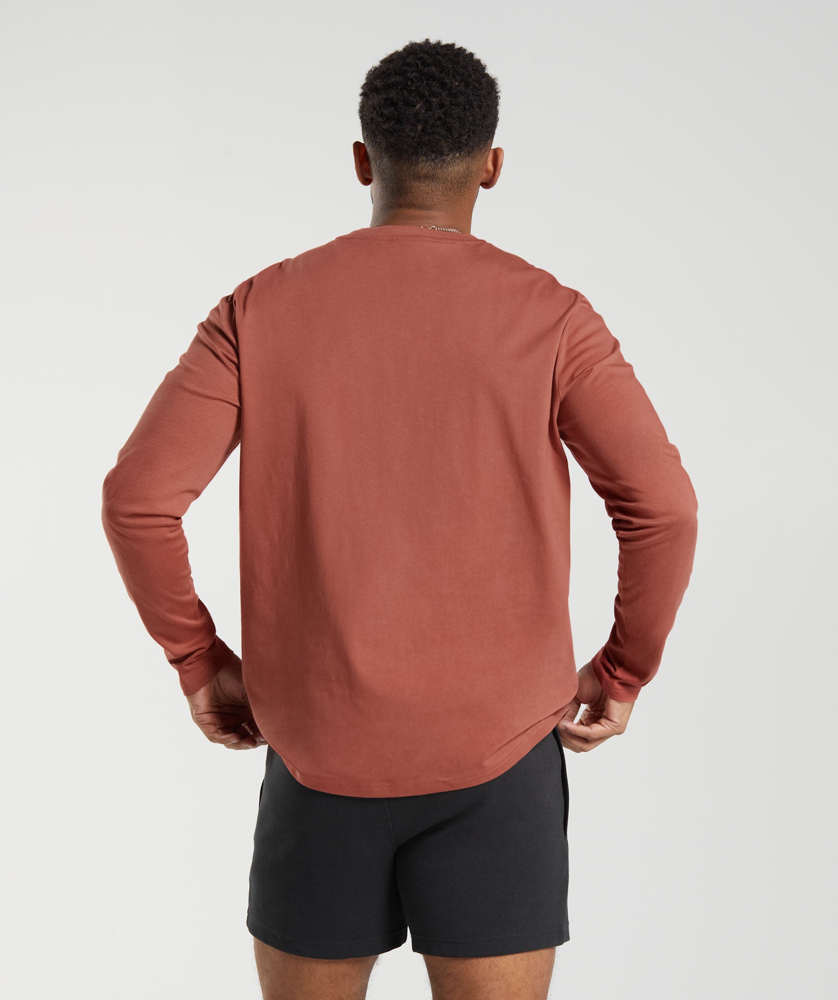 gymshark-crest-long-sleeve-t-shirt-persimmon-red-ss23