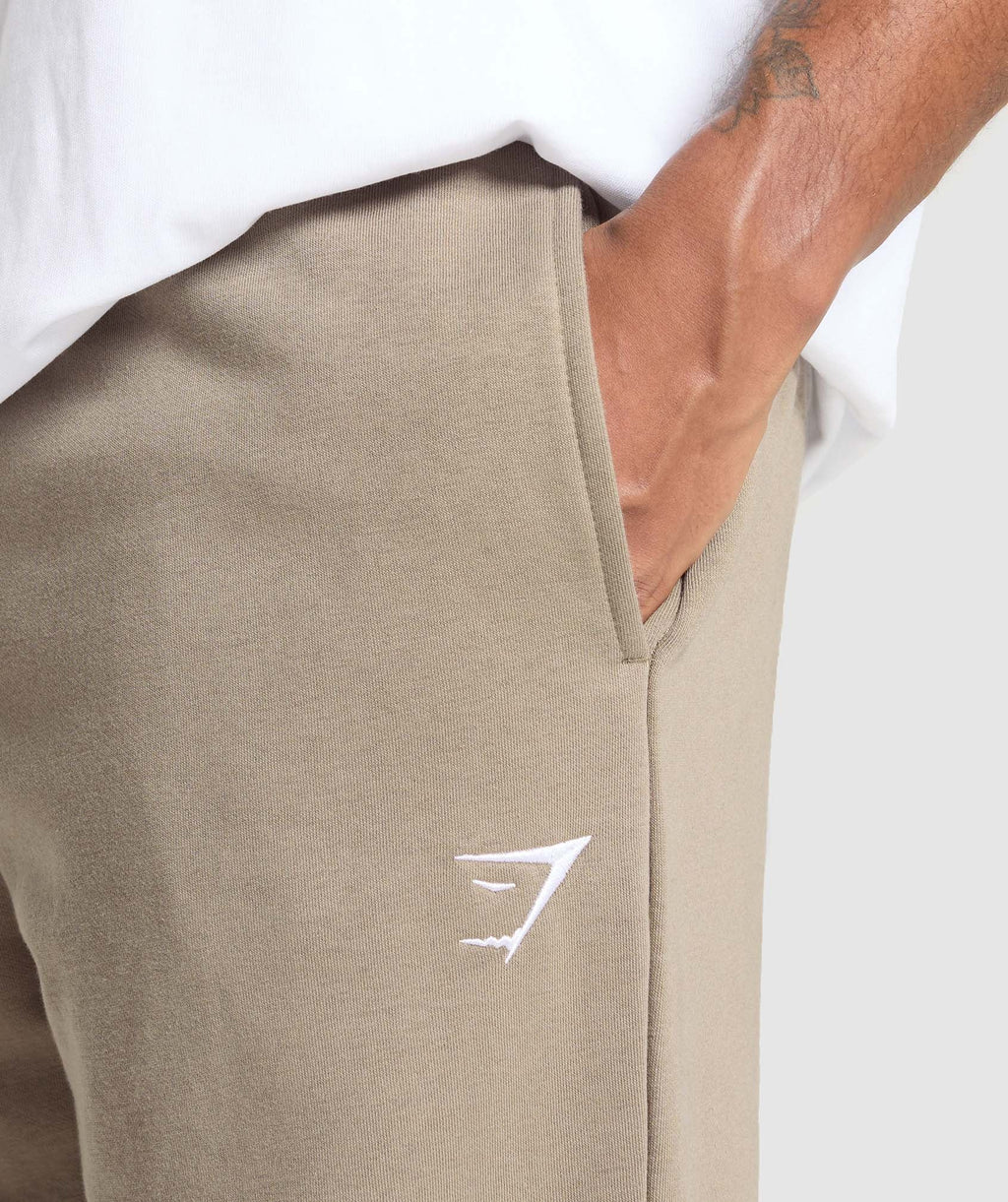 gymshark-crest-straight-leg-joggers-lifestyle-brown-ss25