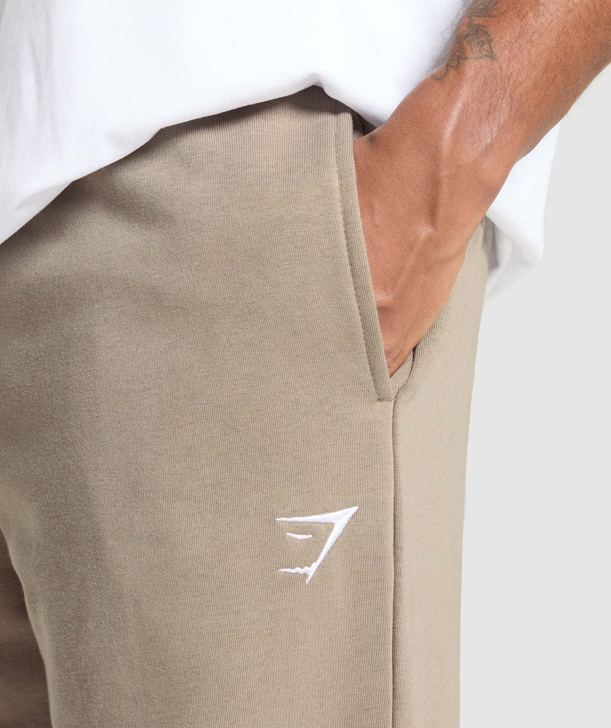 gymshark-crest-straight-leg-joggers-lifestyle-brown-ss25