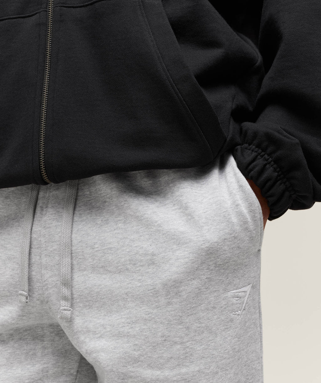 gymshark-crest-straight-leg-joggers-light-grey-marl-aw23
