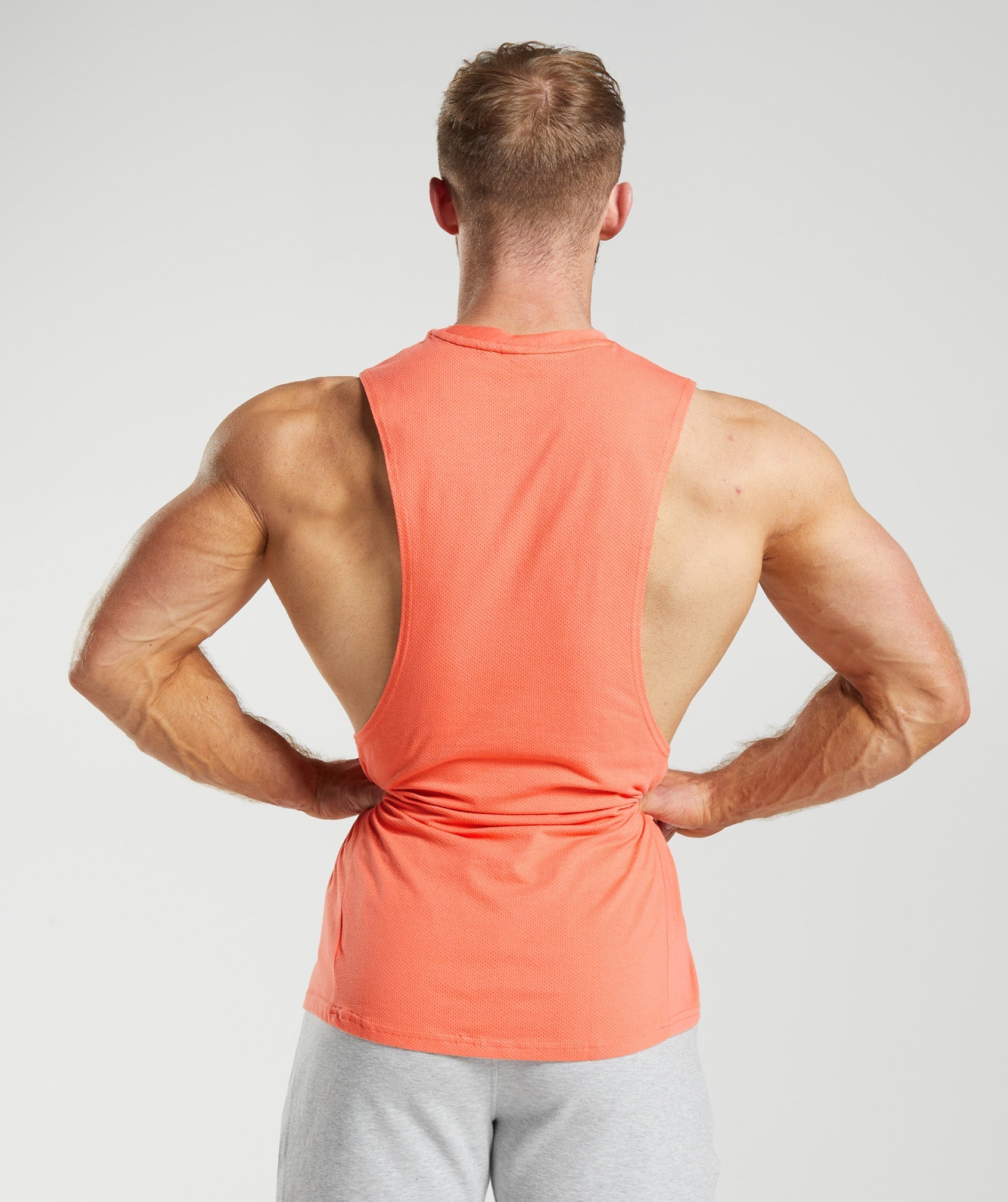 gymshark-react-drop-arm-tank-aerospace-orange-ss23