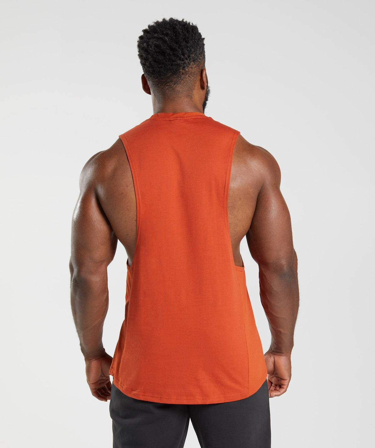 gymshark-react-drop-arm-tank-cayenne-red-aw22