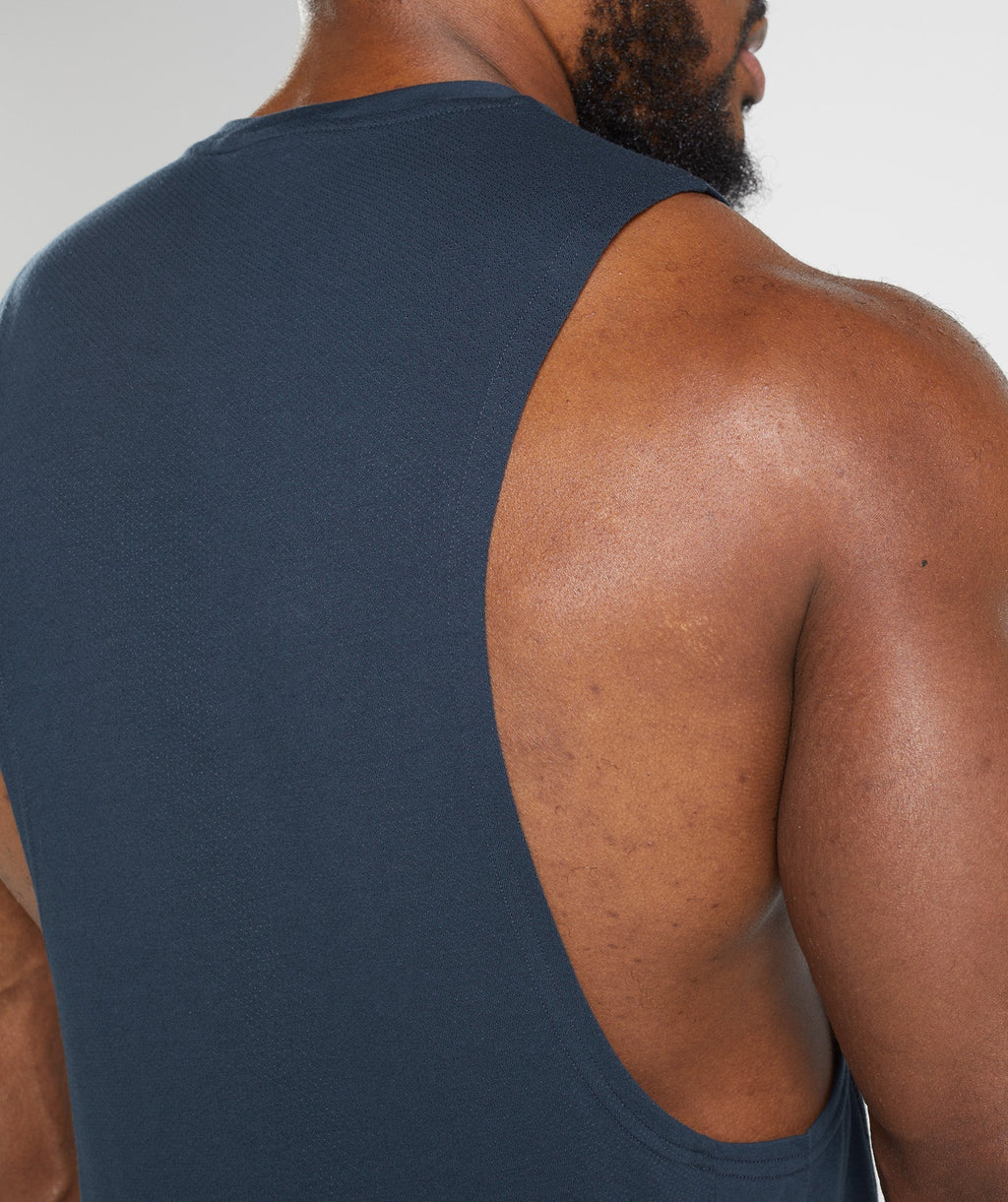 gymshark-react-drop-arm-tank-navy-aw22