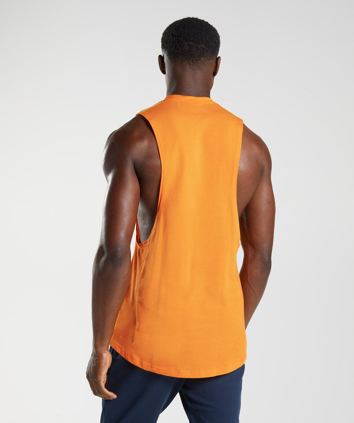 gymshark-react-drop-arm-tank-sunburst-orange-aw22