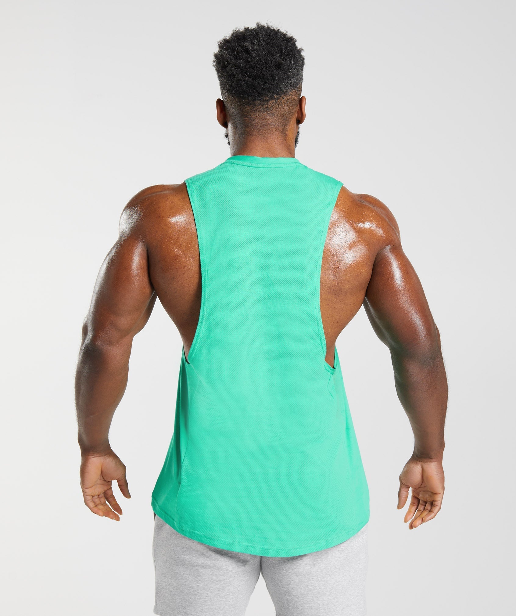 gymshark-react-drop-arm-tank-tropic-green-ss23