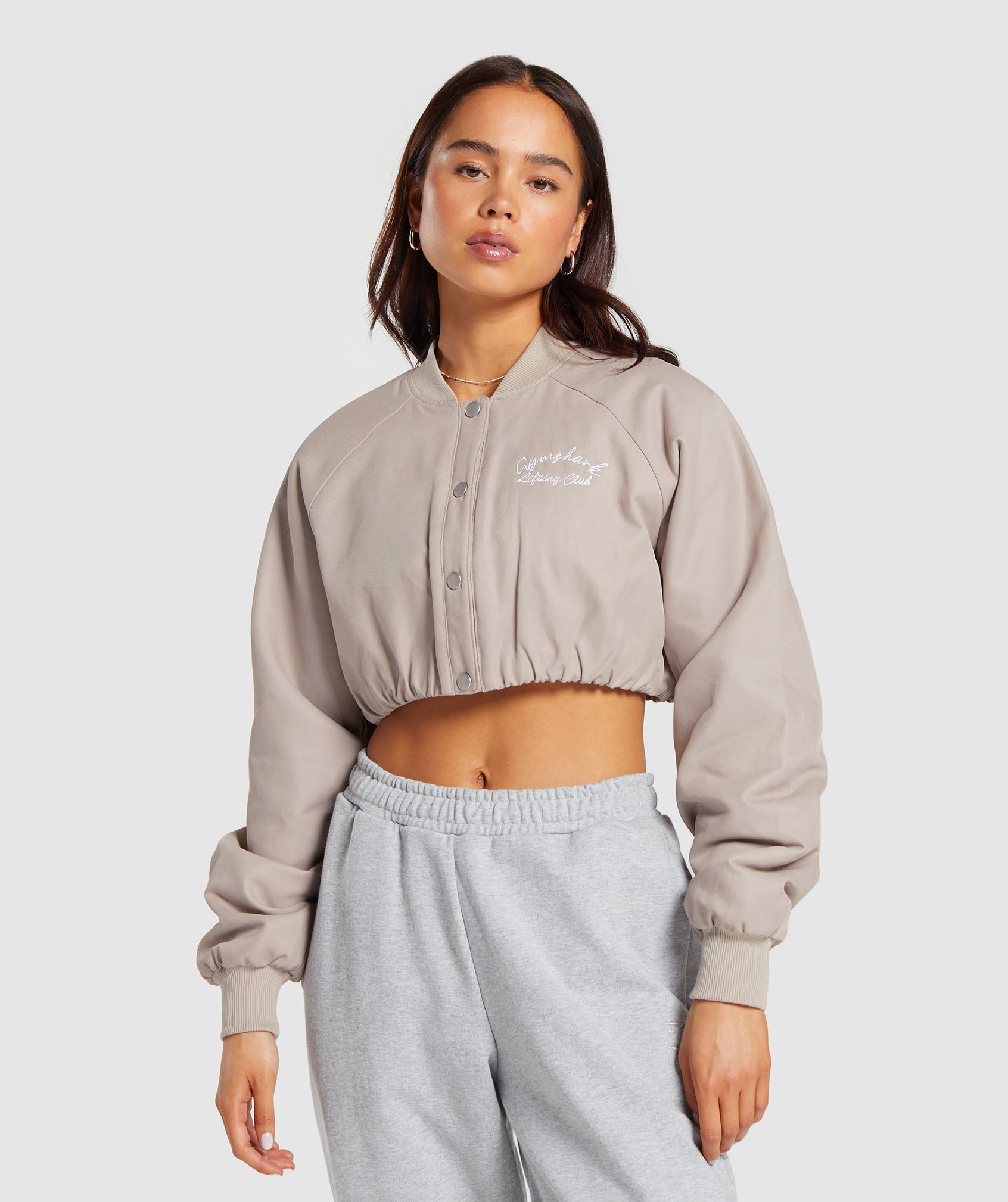 gymshark-cropped-bomber-jacket-stone-pink-ss24