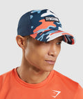 gymshark-trucker-cap-orange-print-ss22