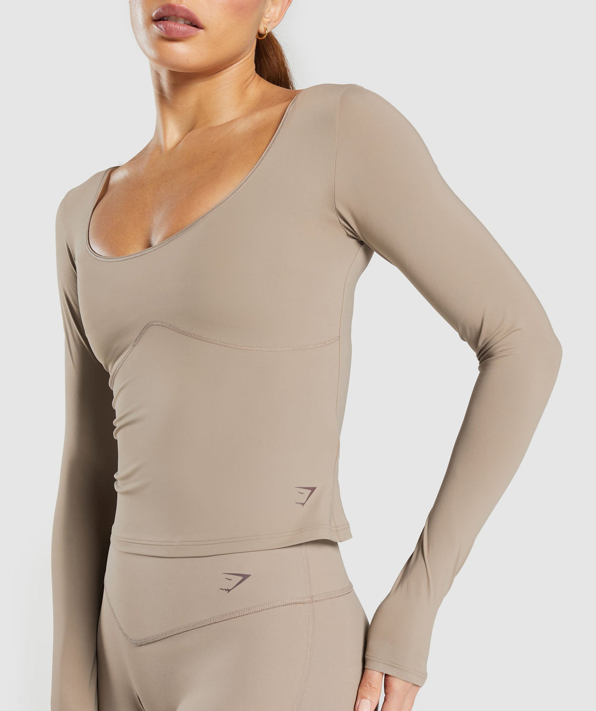gymshark-elevate-long-sleeve-top-lifestyle-brown-ss25
