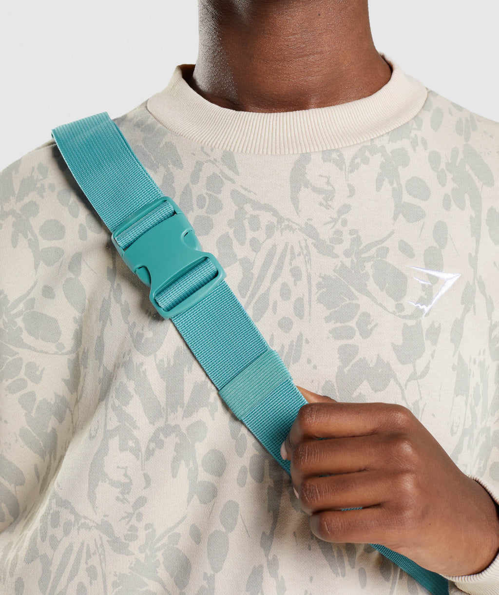 gymshark-adapt-animal-graphic-sling-bag-teal-print-aw21